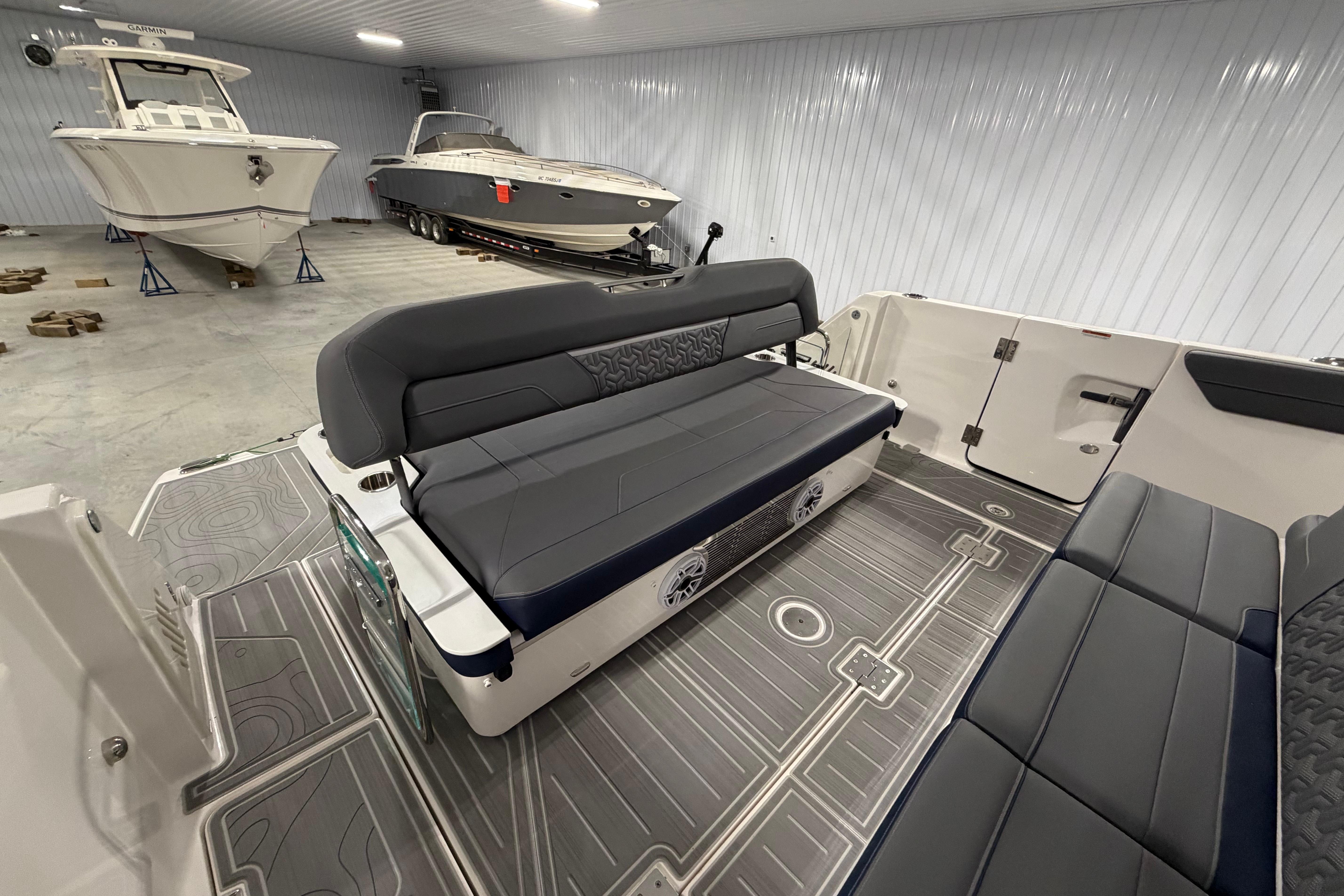 Interior of a 2027 Regal 38 Surf boat in a storage facility.