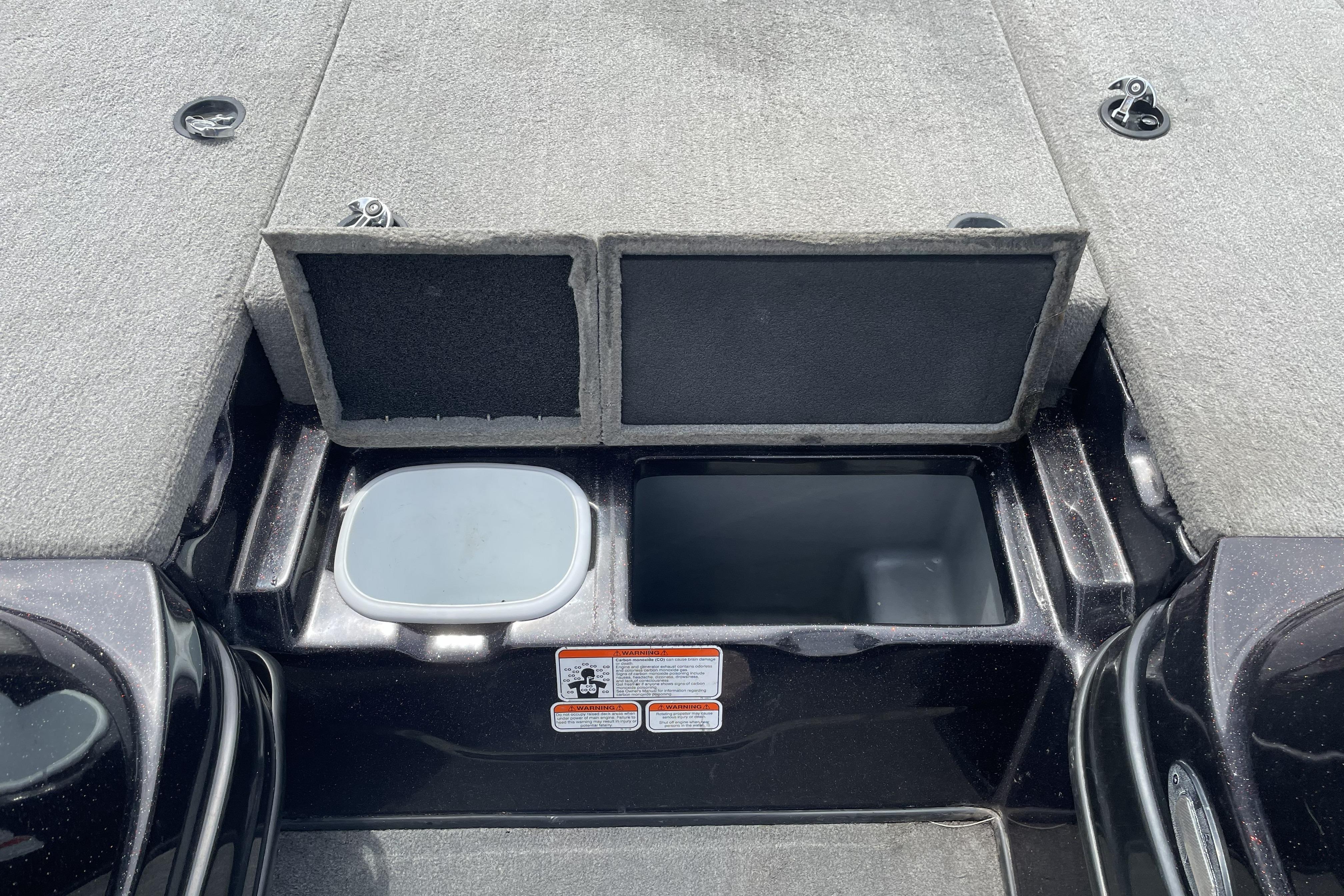 2013 Nitro Z-8 boat storage compartments with open lids, showcasing interior space.