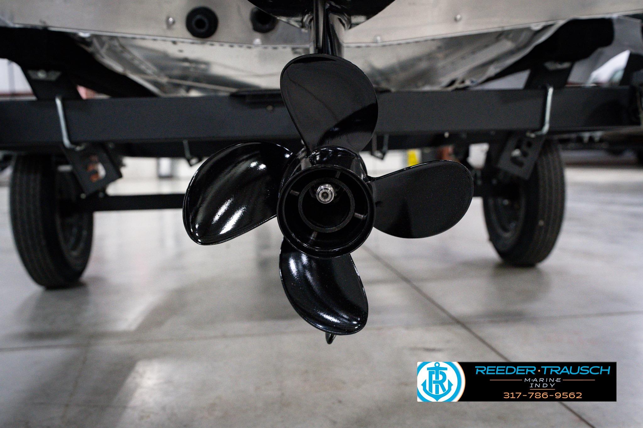 Close-up of a 2026 Lund 1600 Fury SS boat propeller on a trailer.