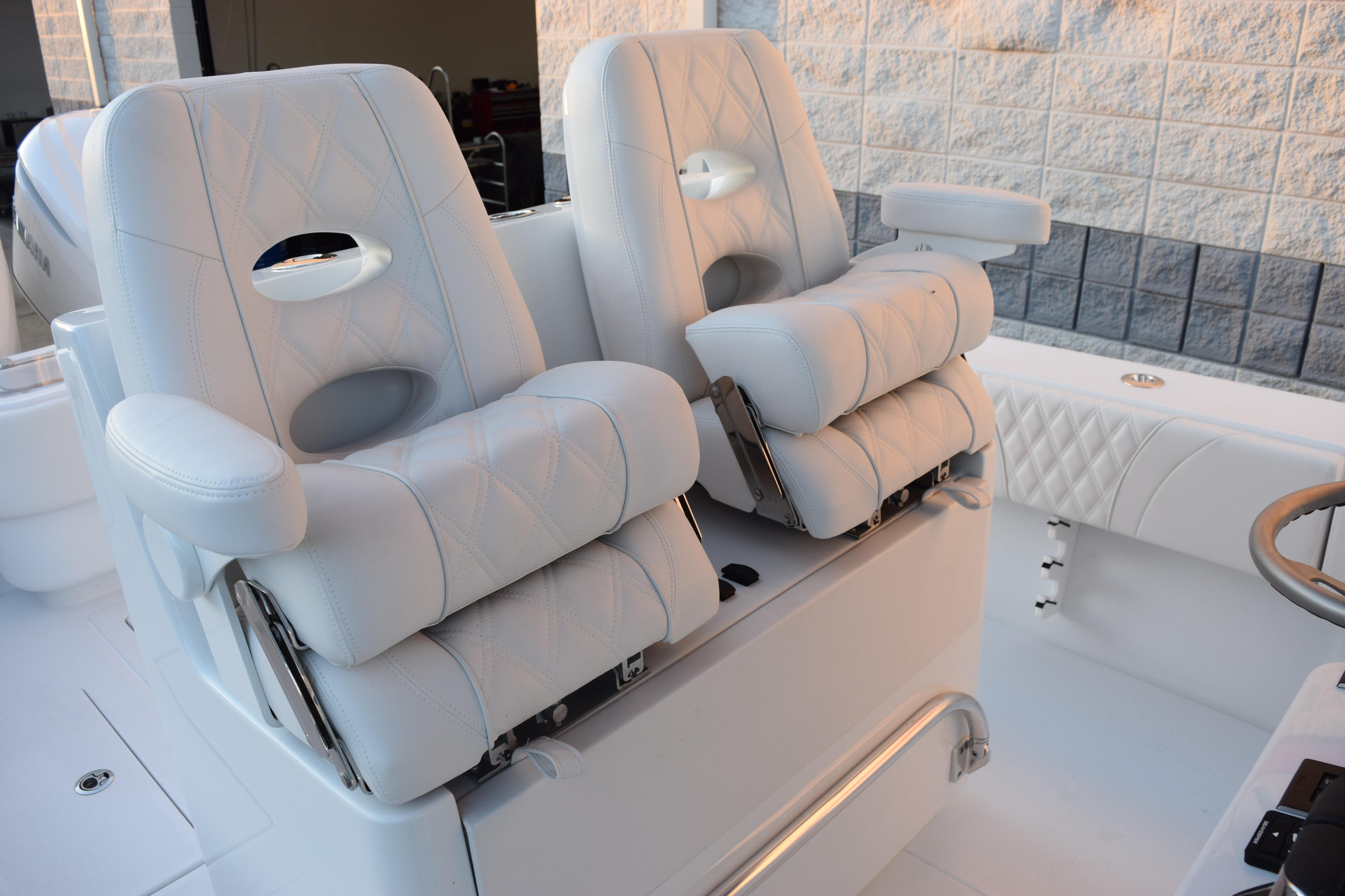 Luxurious seating on 2026 Contender 32 ST boat, featuring plush white upholstery and modern design.