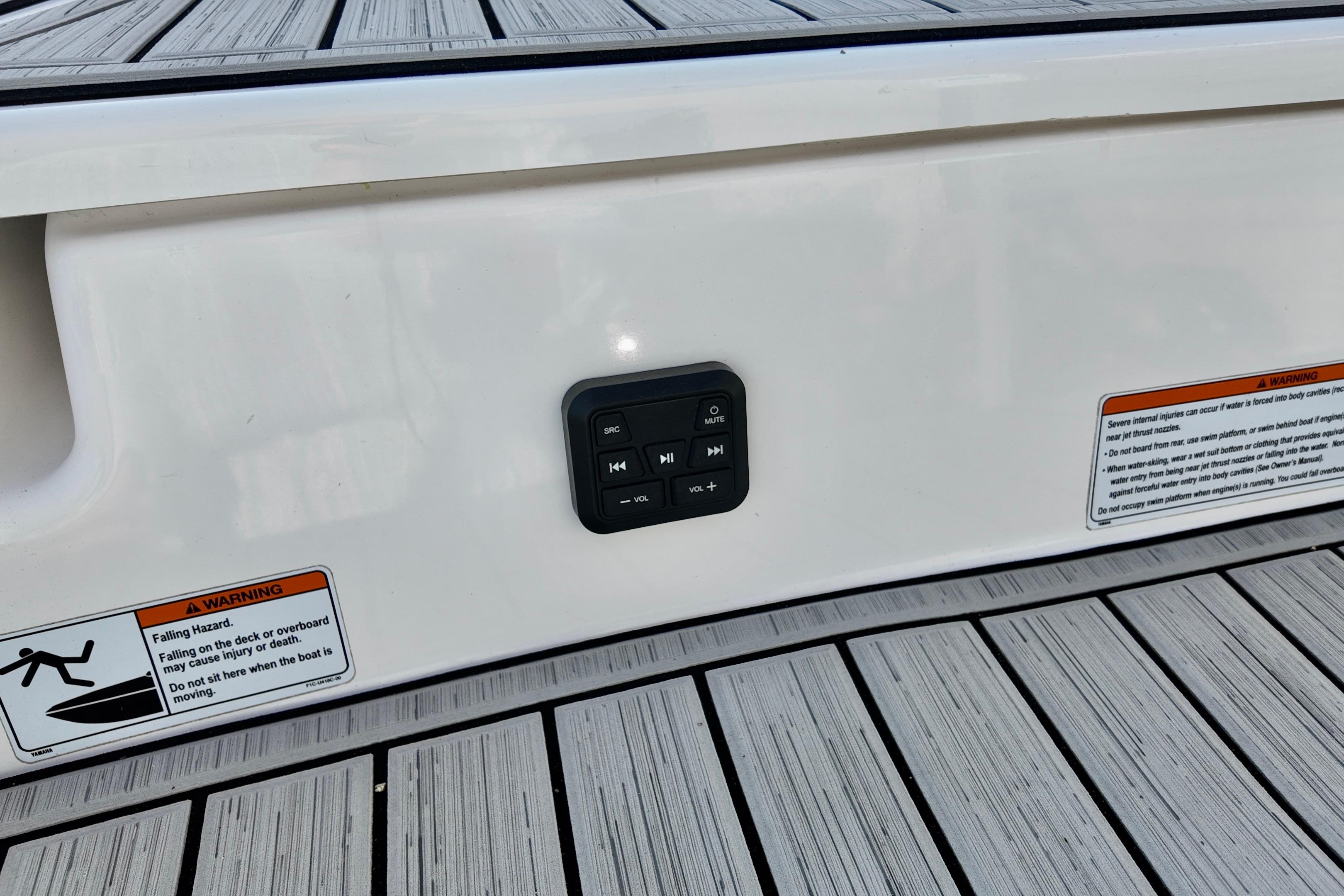 2023 Yamaha 195S boat deck with control panel and safety warnings.