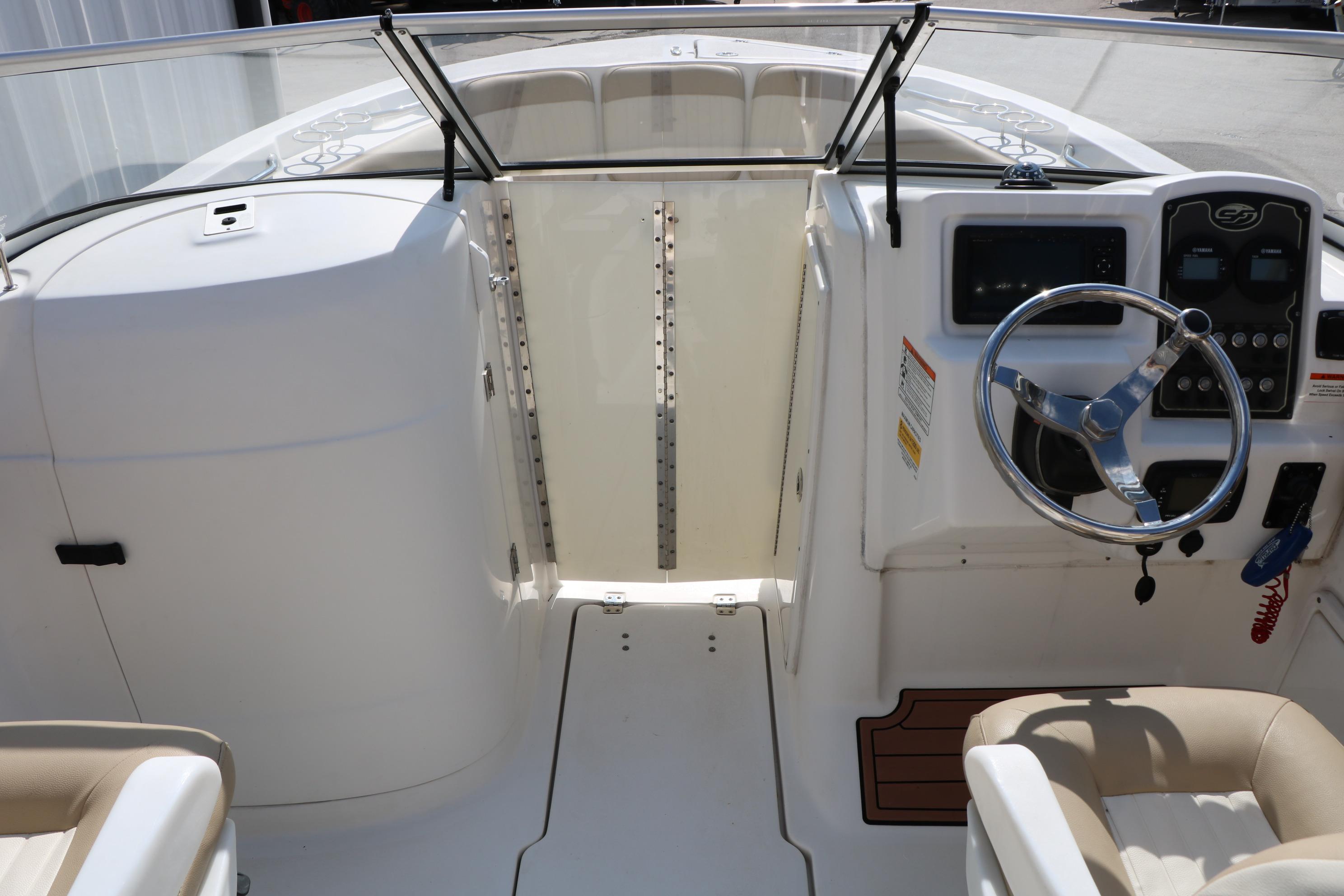 2017 Sea Fox 226 Traveler boat cockpit with steering wheel and dashboard controls.