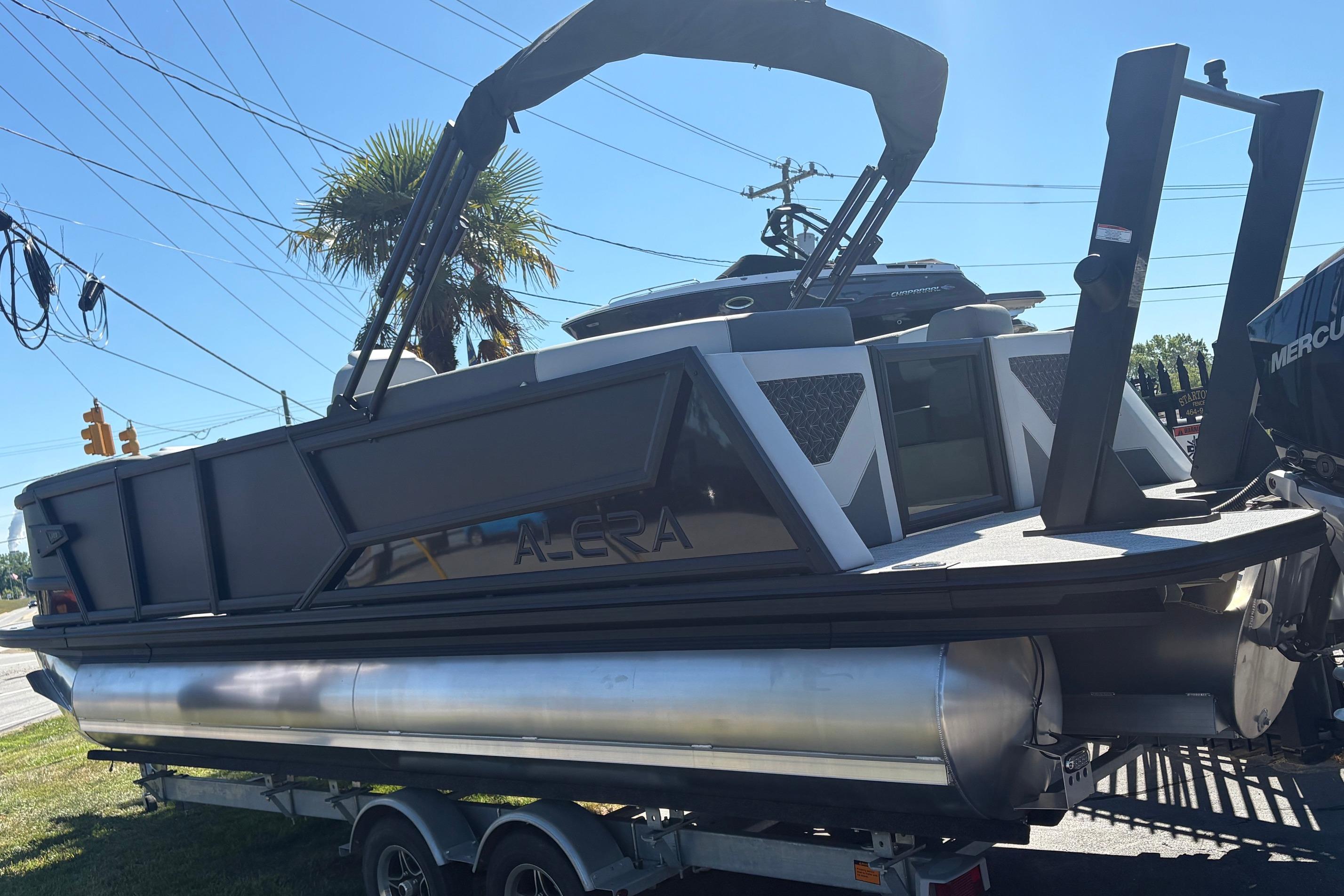 2026 Alera 23Q pontoon boat on trailer, featuring sleek design and modern amenities.