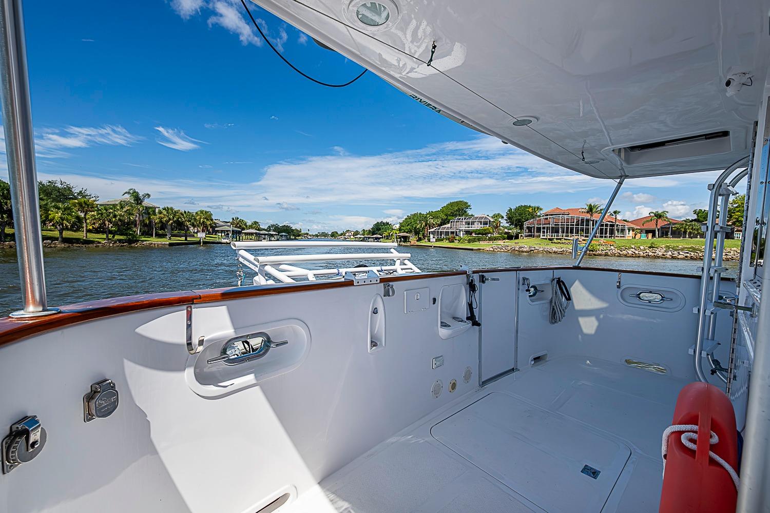 Magna Marine Nova Scotia 47 yacht deck, 2003 model, cruising on a scenic river.