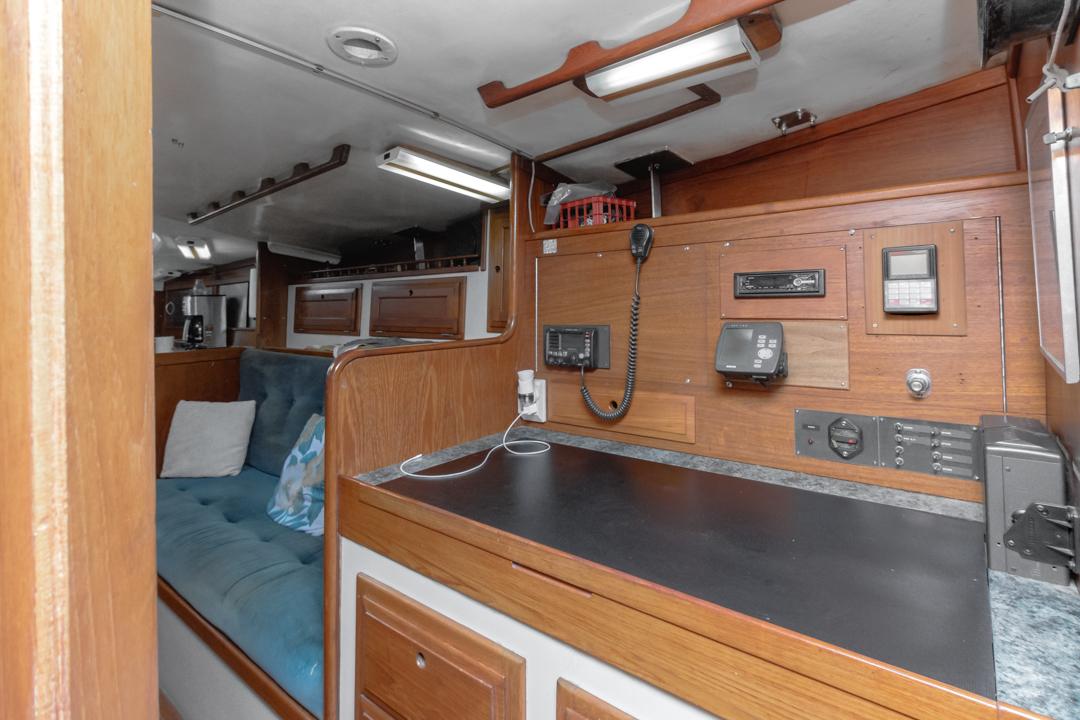 Interior of 1972 Columbia 43 Custom sailboat with navigation equipment and seating area.
