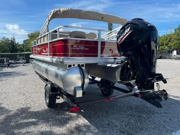2024 Sun Tracker Bass Buggy 18 DLX pontoon boat with Mercury outboard motor.