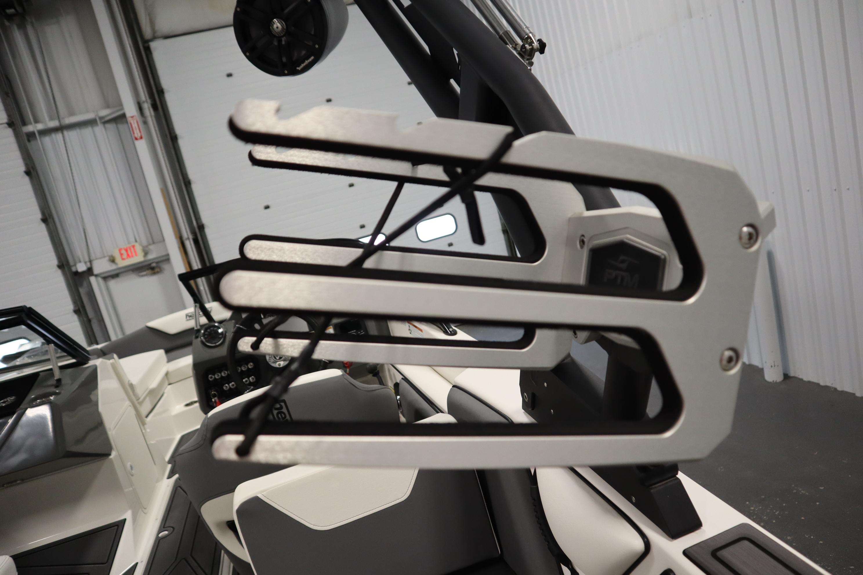 2023 Heyday WT Surf boat interior with wakeboard rack and modern design features.