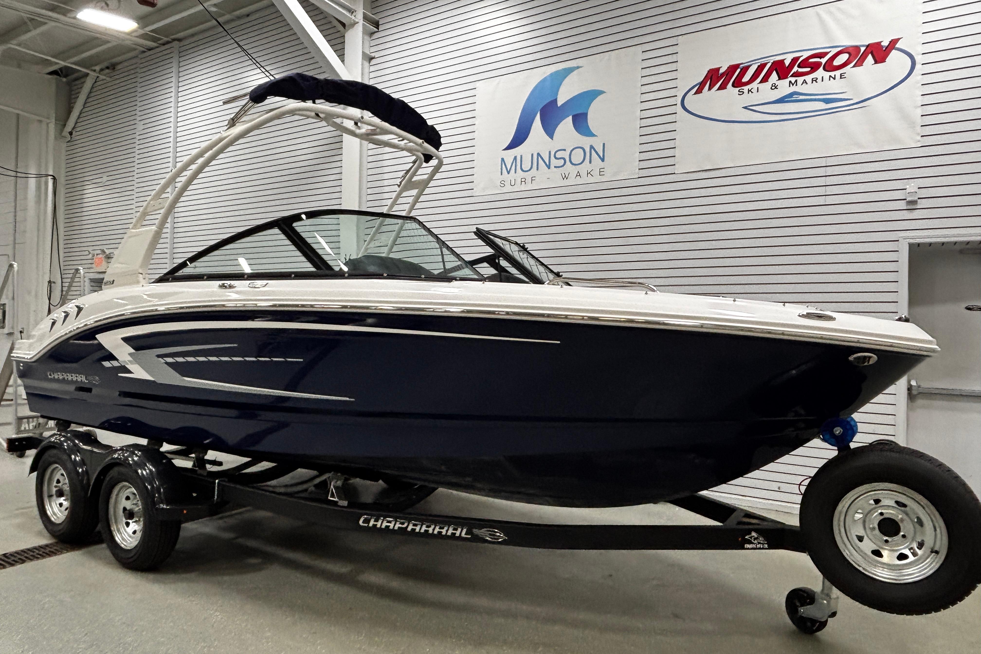 2026 Chaparral 21 SSi boat on trailer in showroom, Munson Ski & Marine.