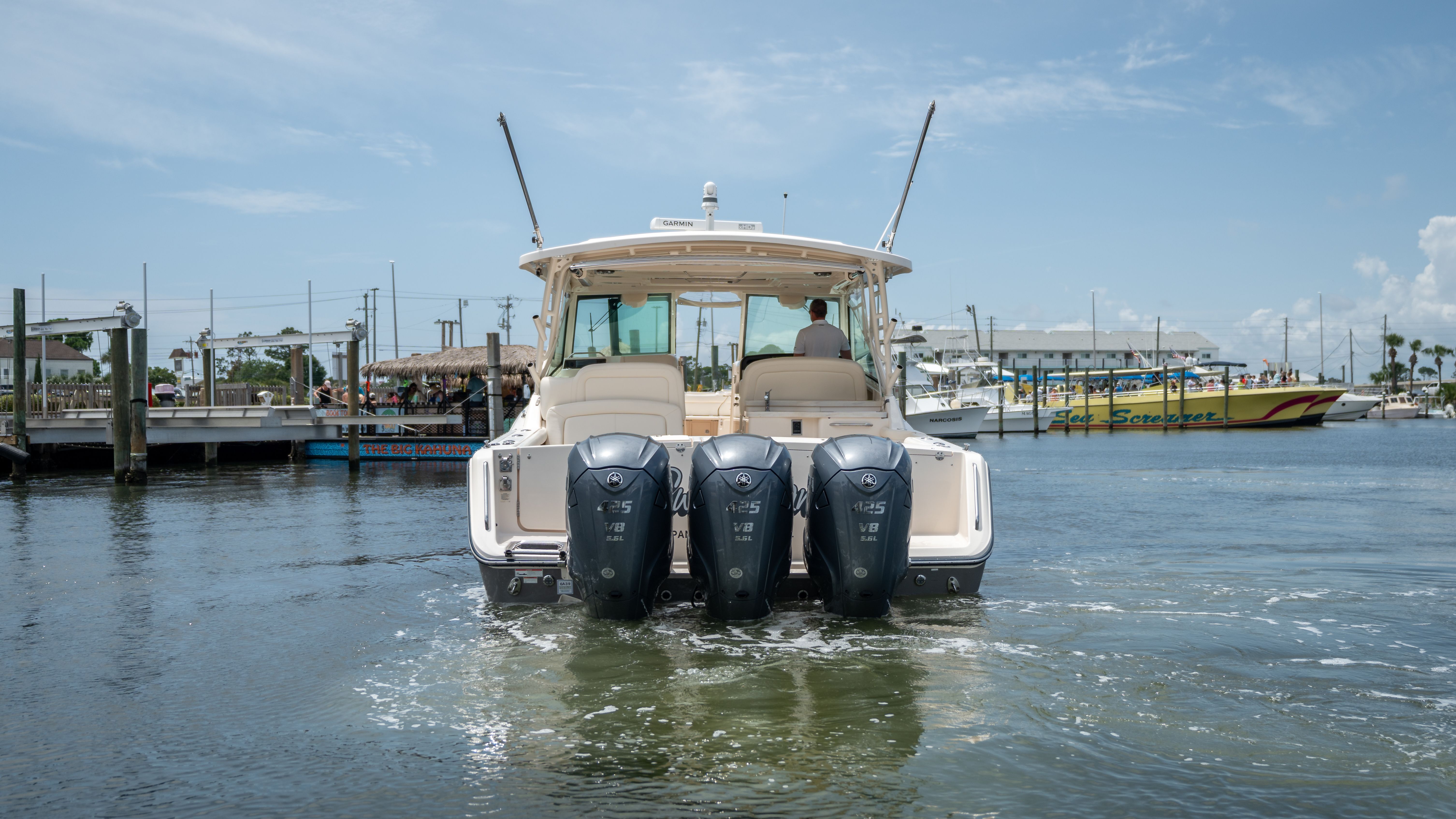 2019 Grady-White 375 Freedom on the water with three outboard engines.