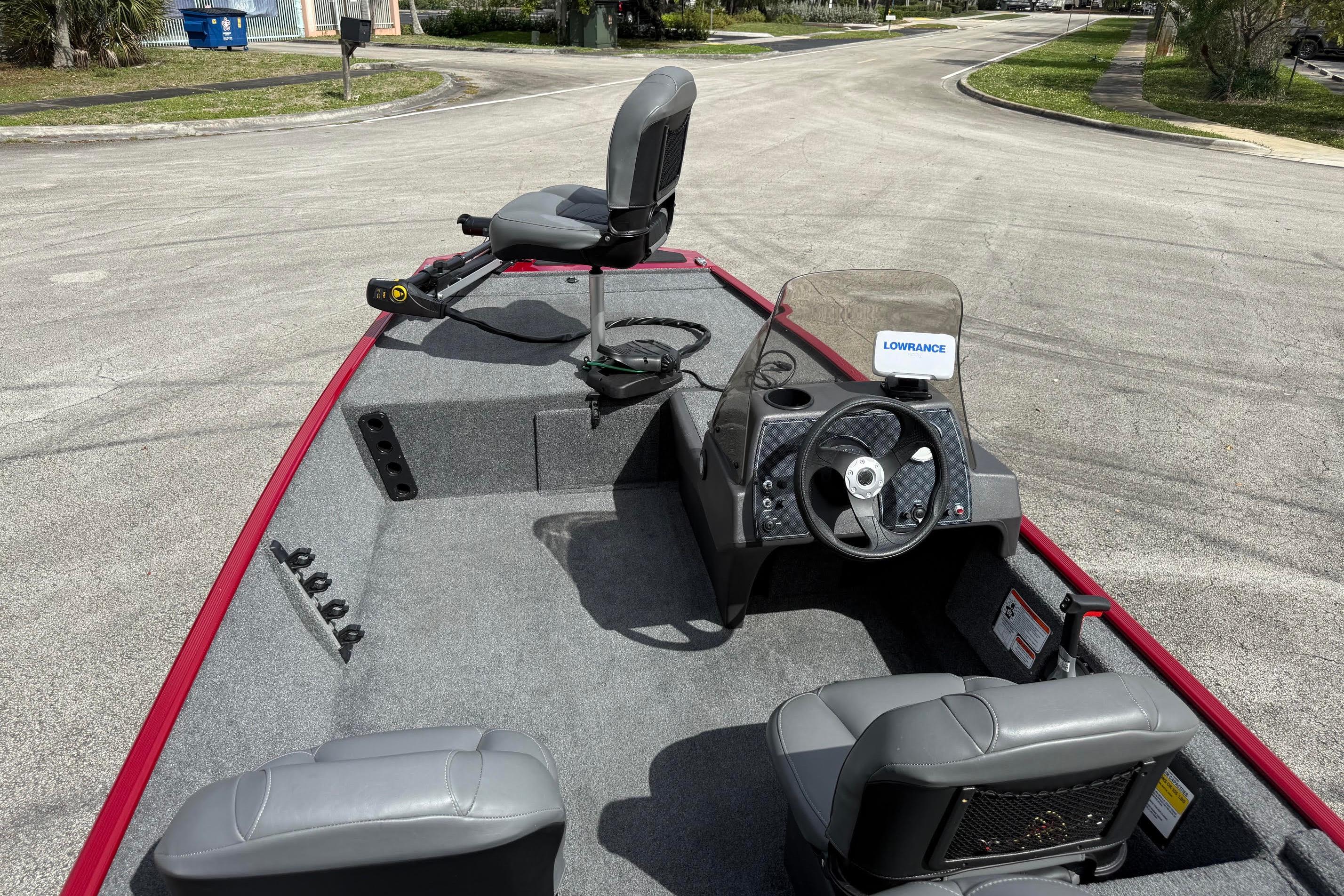 2023 Bass Tracker III Classic boat interior with steering wheel and seating.