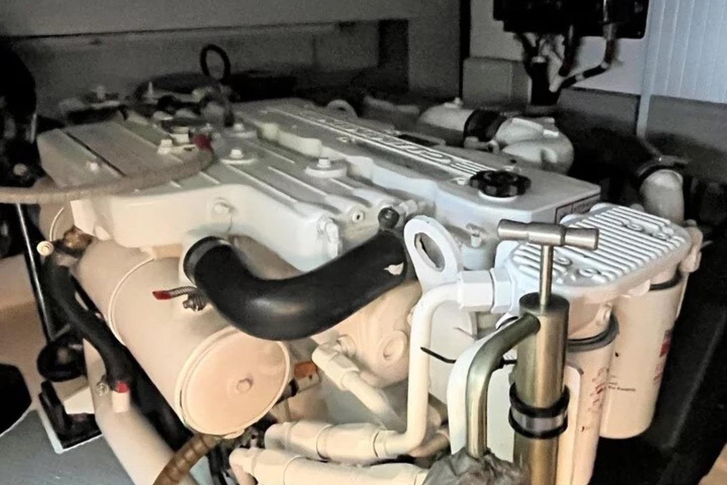 Engine of a 2009 Oyster OM43 yacht, showcasing intricate mechanical components.