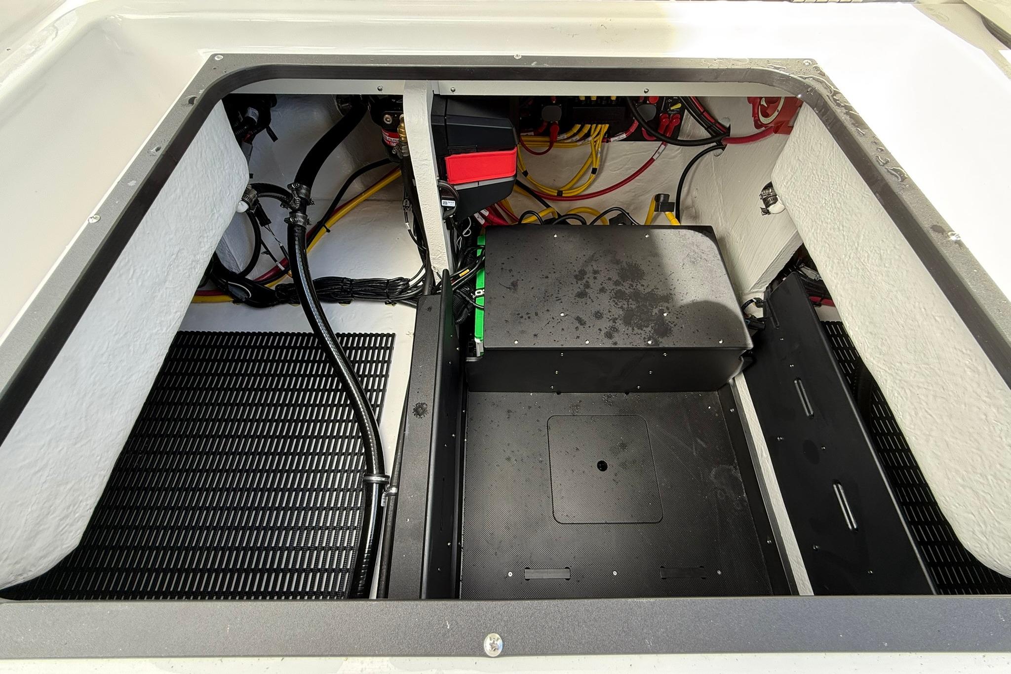 Engine compartment of 2027 Monterey Elite 30 OB boat, showcasing wiring and components.