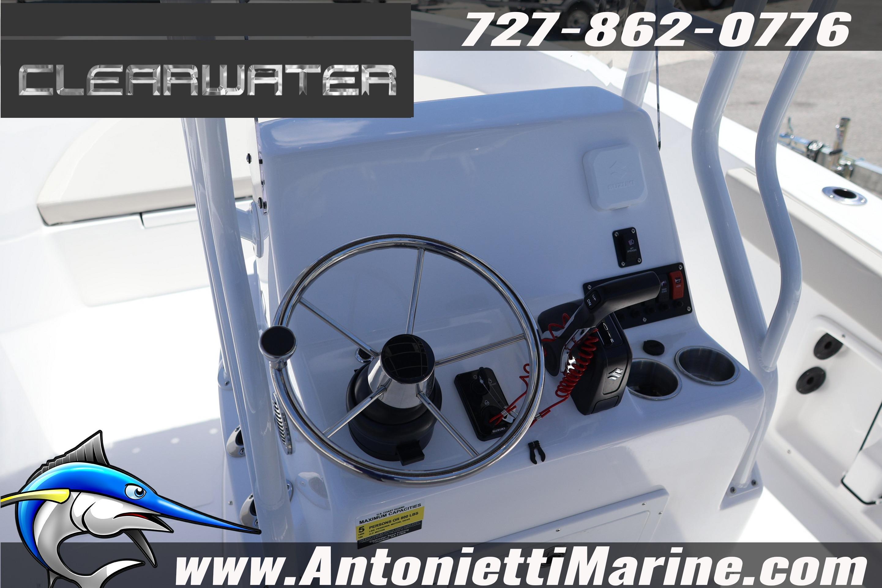 Clearwater 2000 Center Console 2026 boat dashboard with steering wheel and controls.