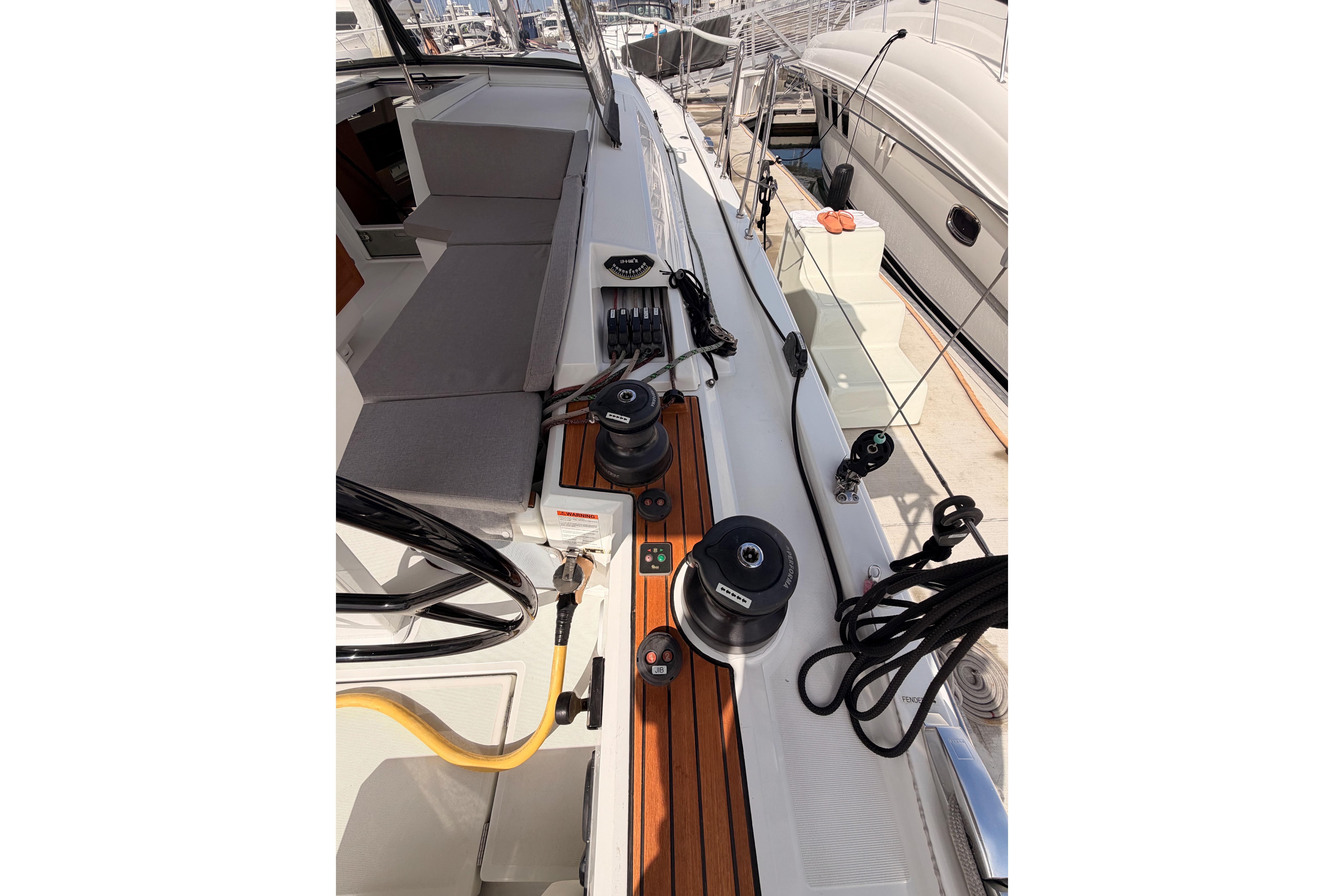 2020 Beneteau Oceanis 46.1 yacht deck with winches and seating area.