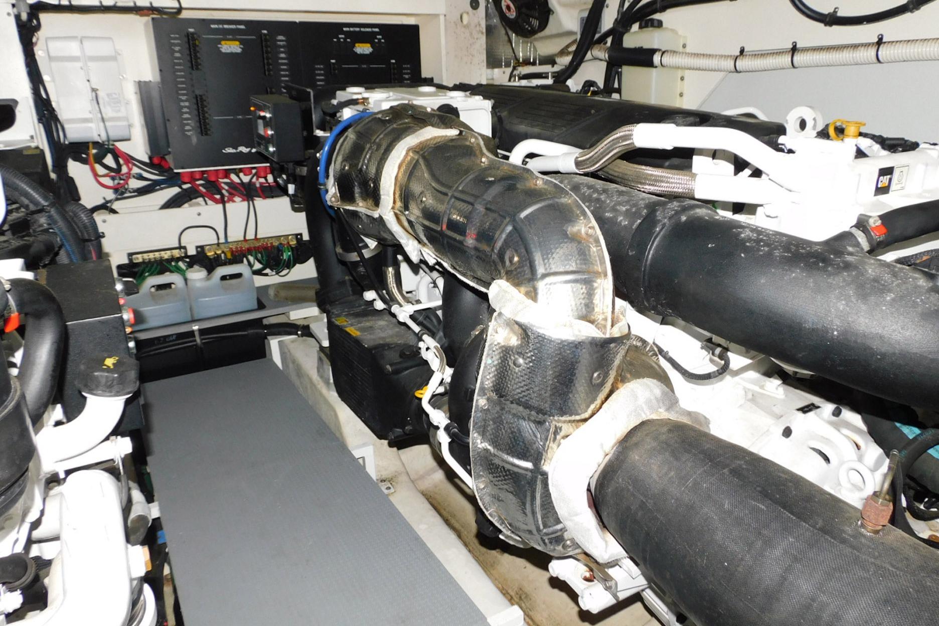 Engine room of 2019 Sea Ray L550 yacht, showcasing complex machinery and wiring.