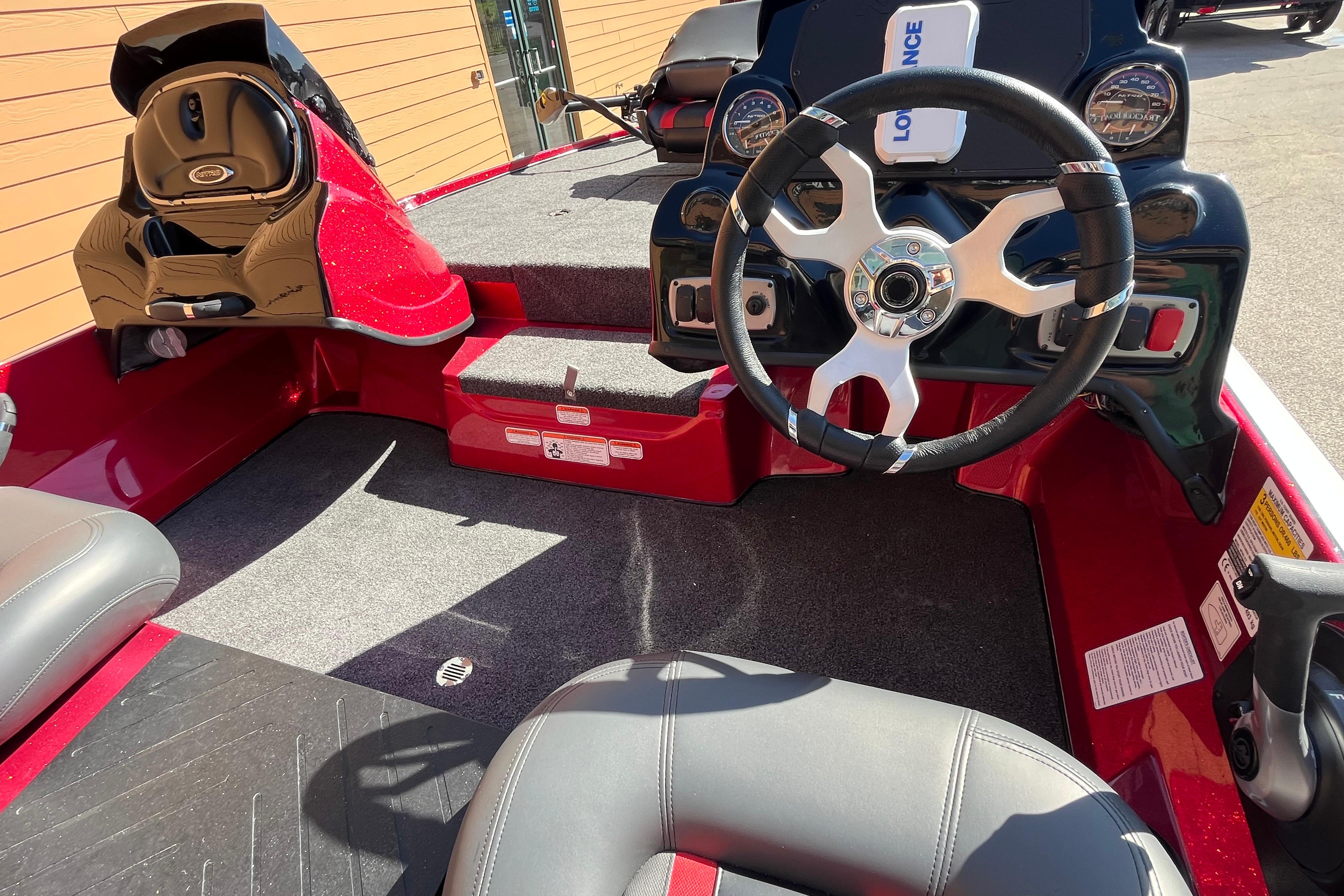 Interior of a 2026 Nitro Z17 boat featuring a sleek steering wheel and modern dashboard.