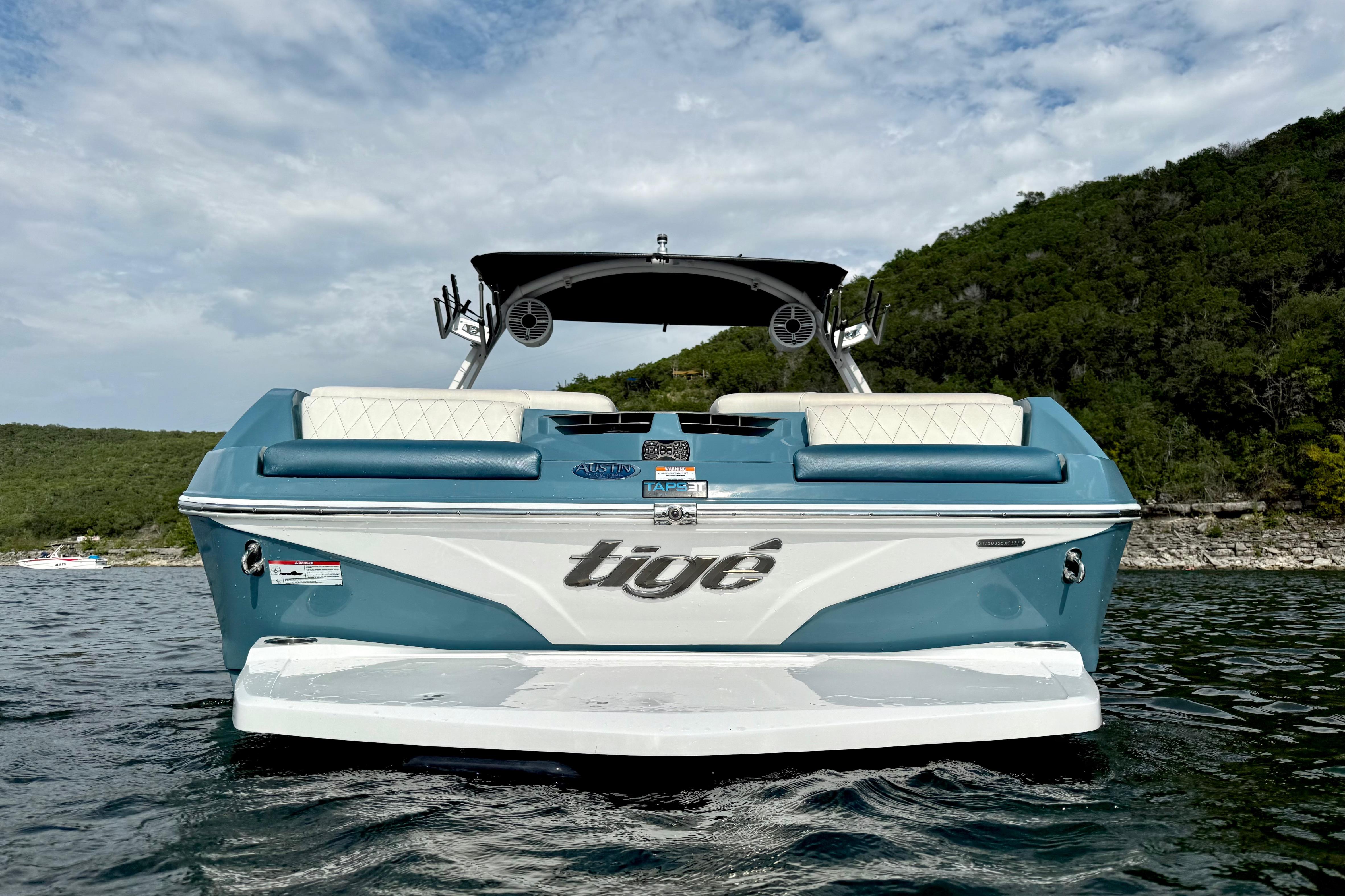 2021 Tige Z3 boat on water, featuring sleek design and vibrant blue color.