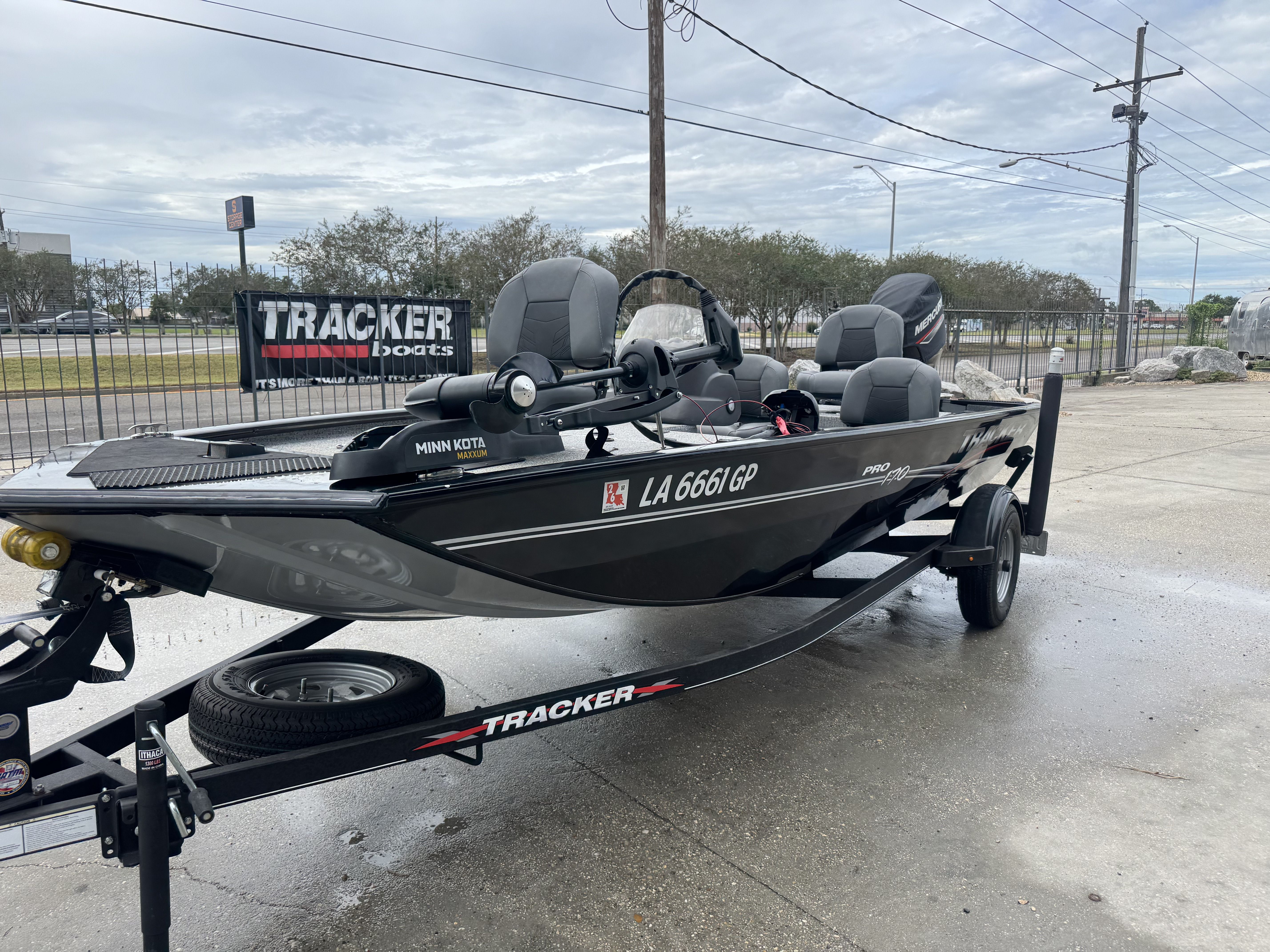 2024 Tracker Pro 170 boat on trailer, displayed outdoors with Minn Kota motor.