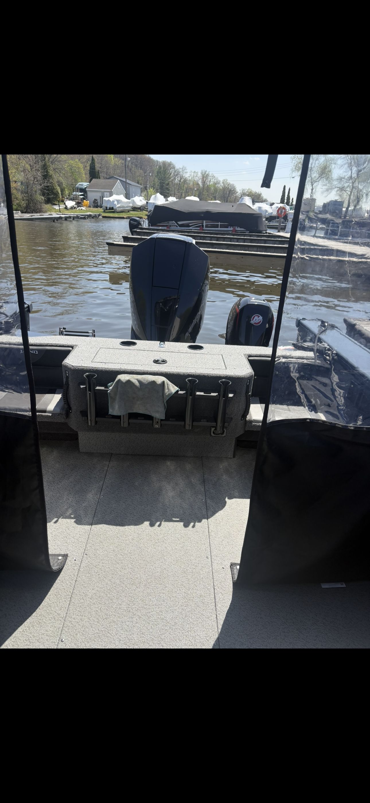 View from inside a Lund Fisherman 2075 boat looking out onto the water.