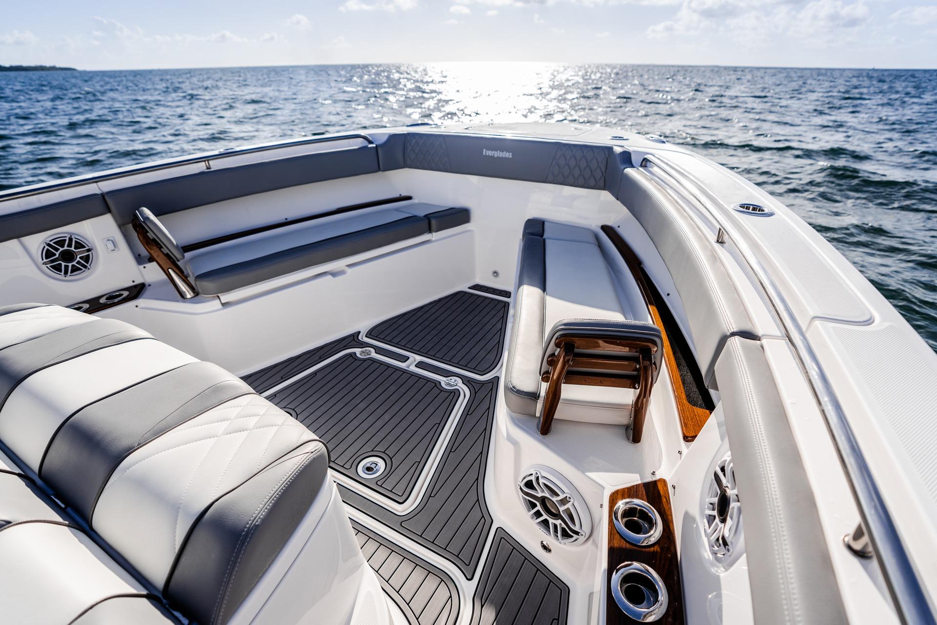 Luxurious 2026 Everglades 455 Center Console boat interior with sleek seating and ocean view.