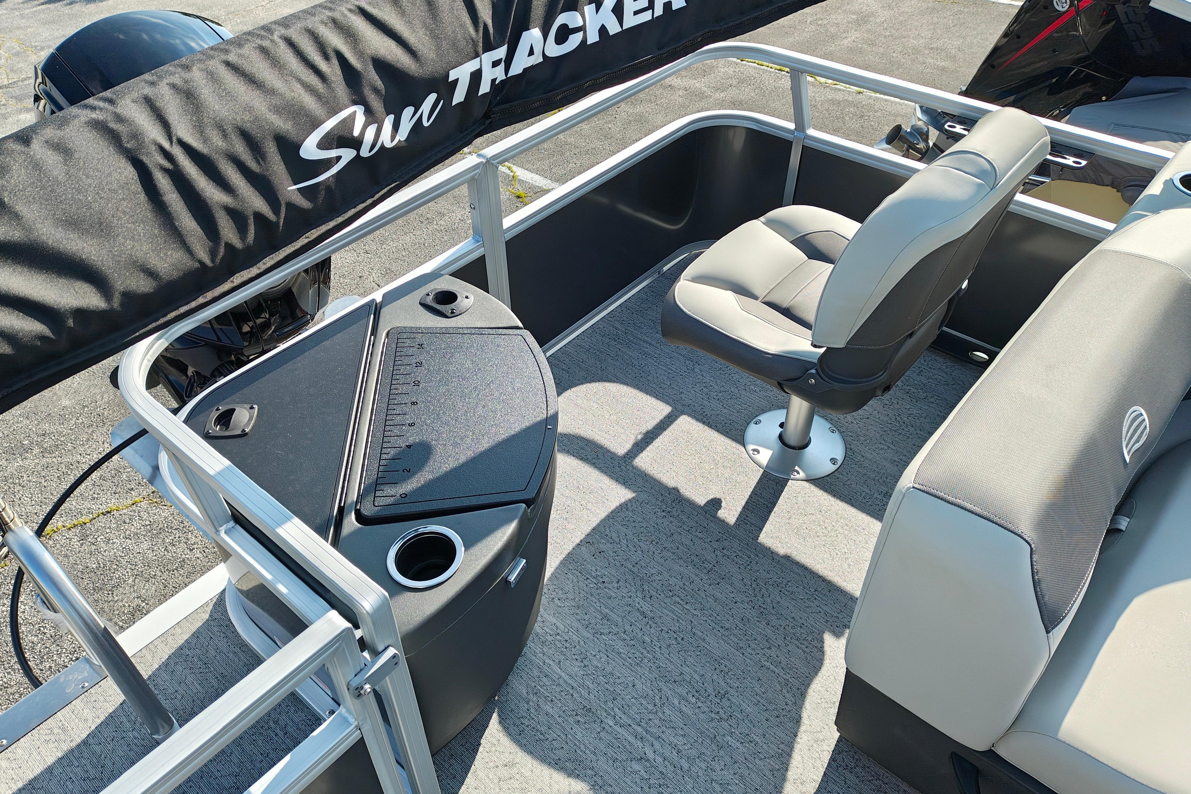 2026 Sun Tracker Bass Buggy 18 DLX pontoon boat interior with seating and console.