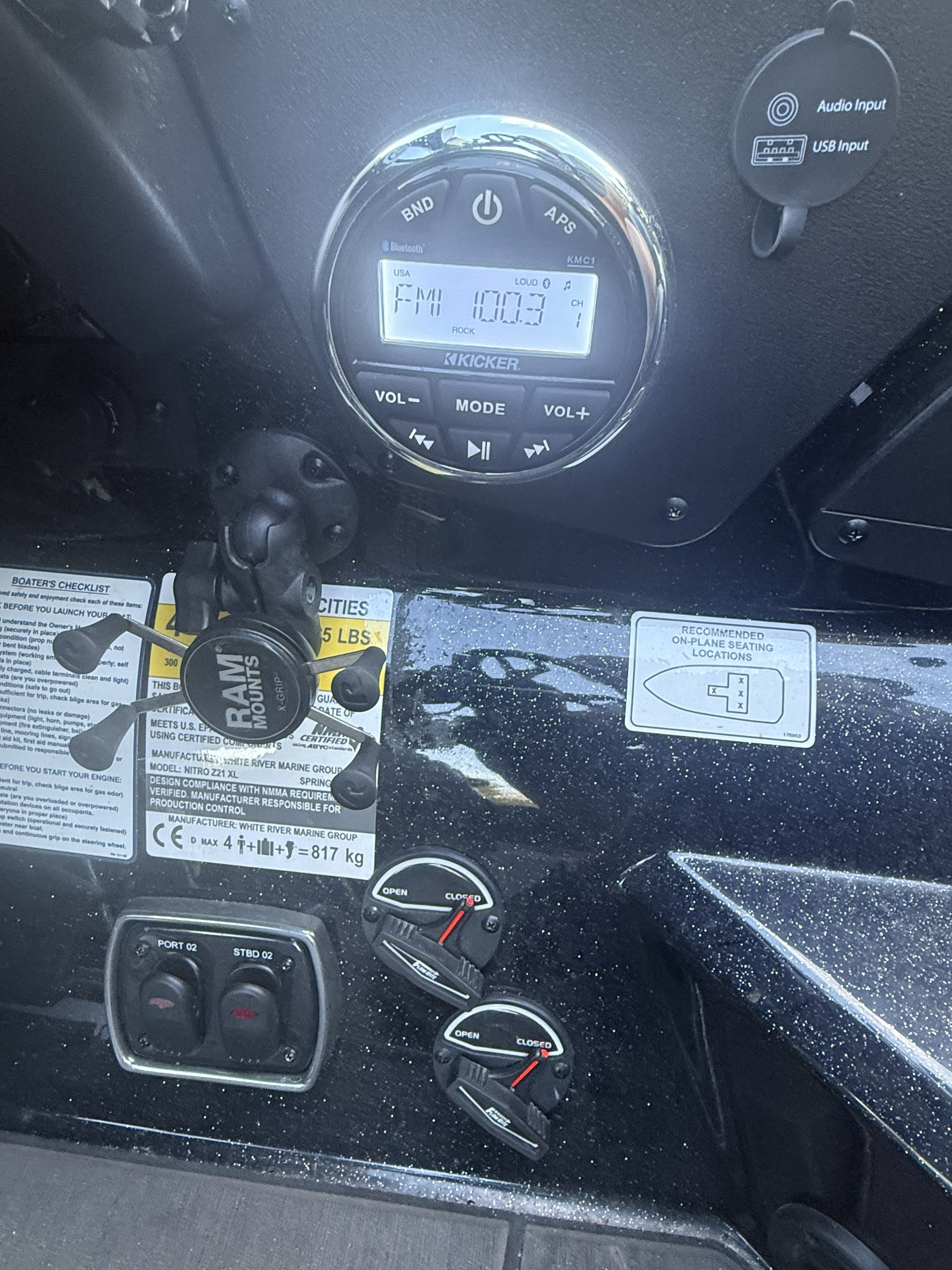 Close-up of a Nitro Z21 XL Pro boat dashboard with radio and controls.