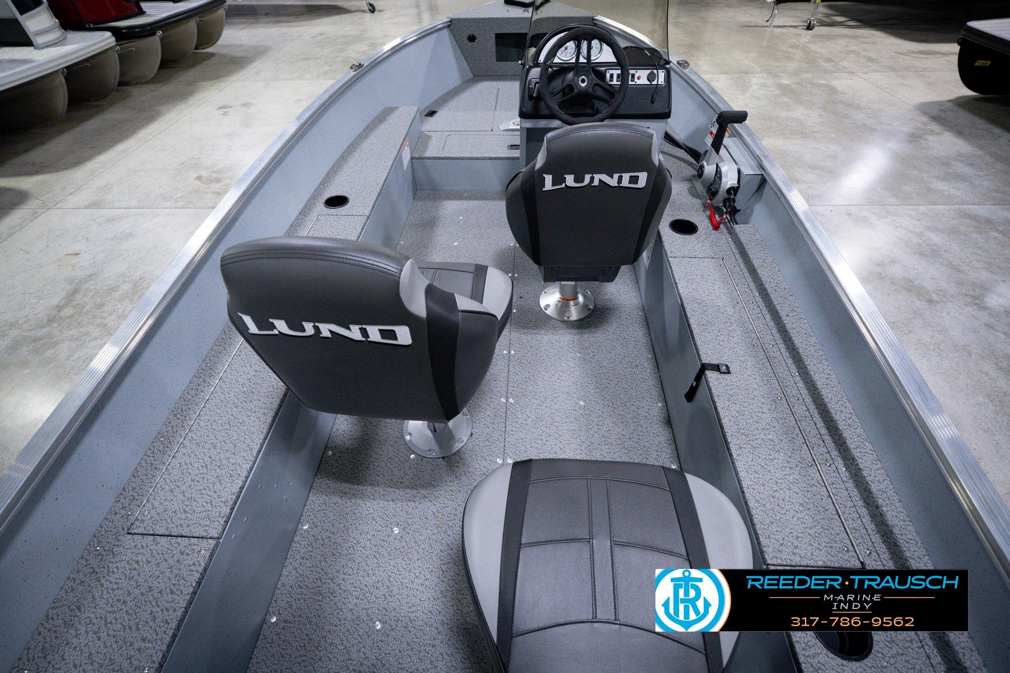 2026 Lund 1600 Fury SS boat interior with seating and steering console.