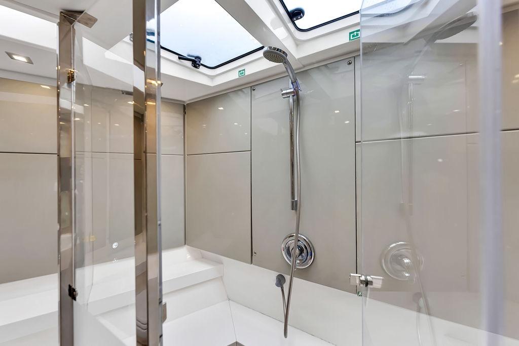 Luxurious shower area in 2012 Fairline Targa 58 yacht, featuring sleek modern design.