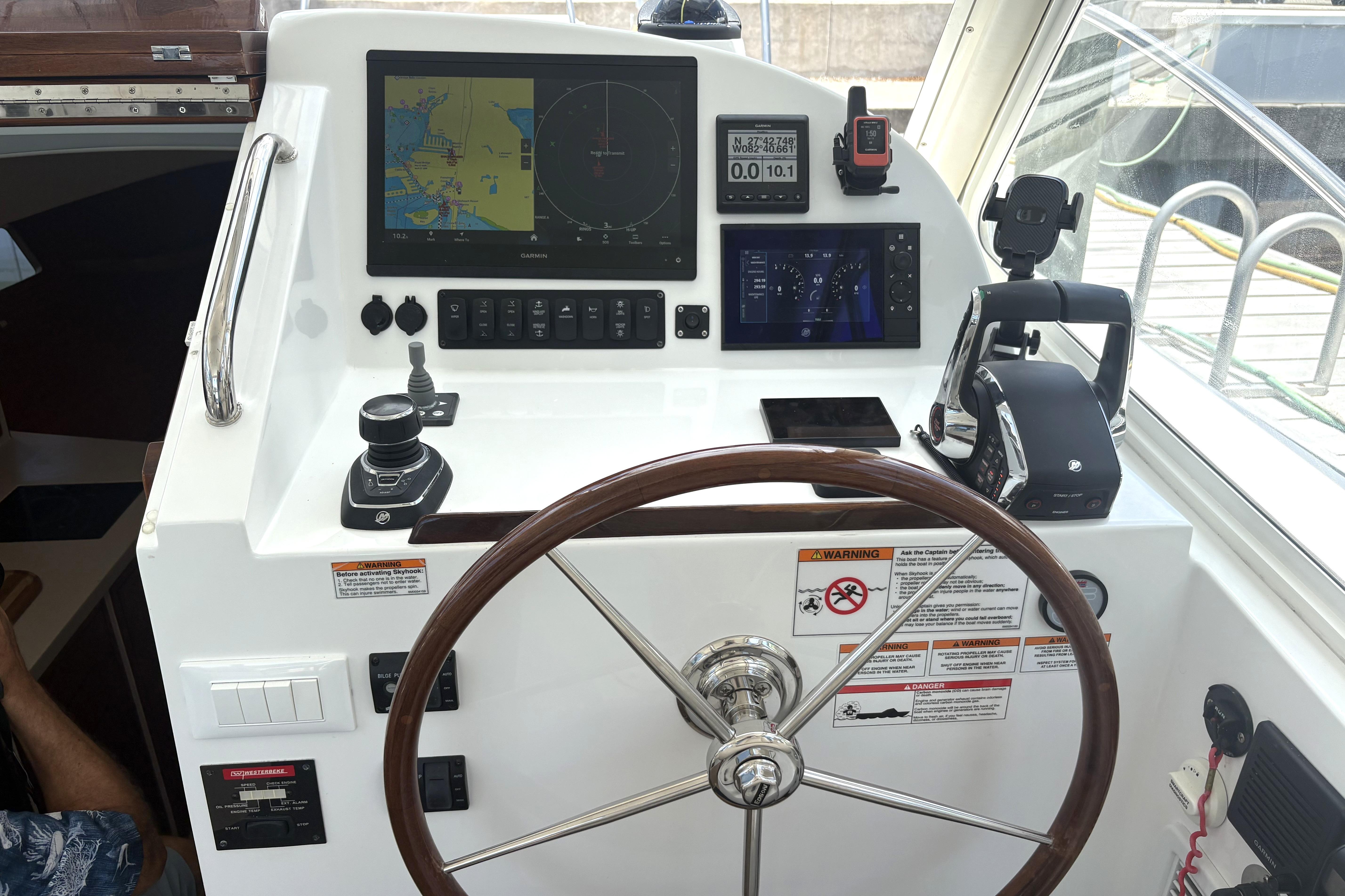 2024 MJM 35z helm with navigation screens, joystick control, and steering wheel.