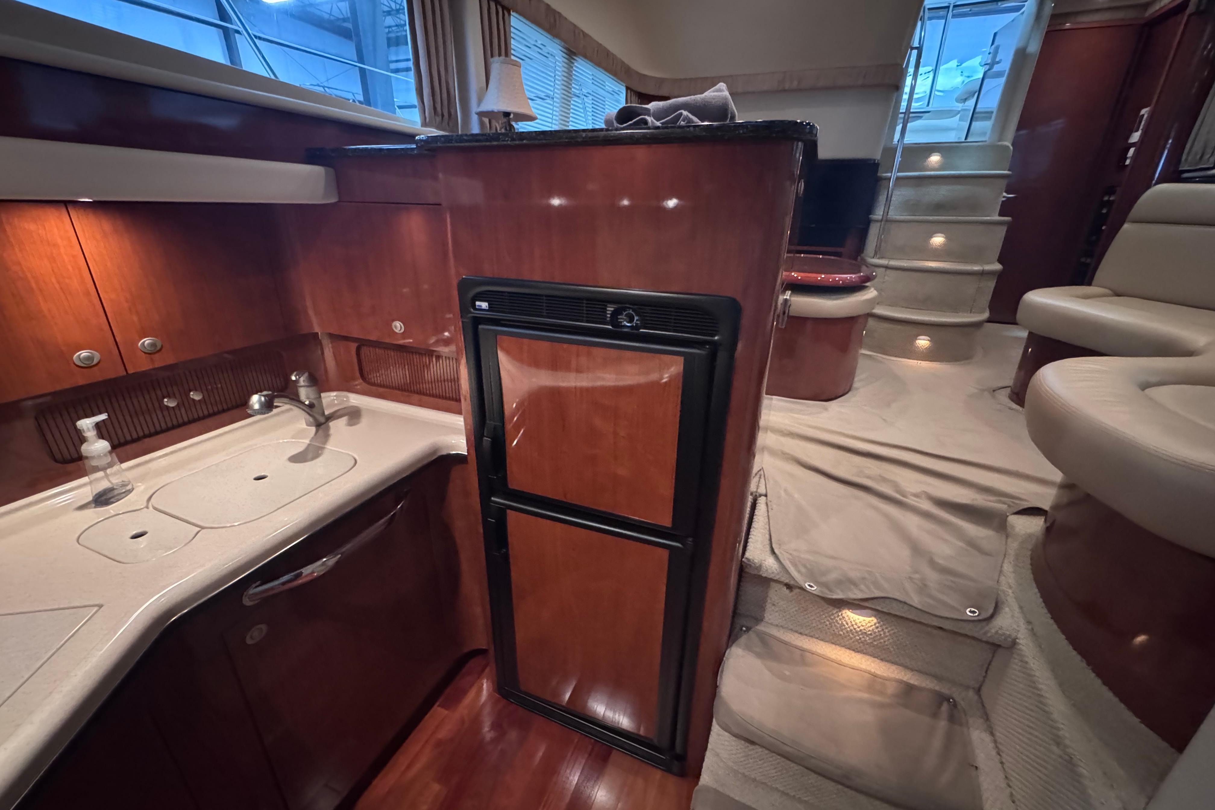 Luxurious interior of 2004 Sea Ray 390 Motor Yacht with elegant wood finishes.
