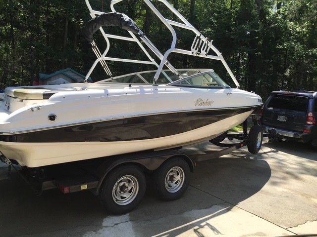 2002 Rinker 212 Captiva Bowrider parked on trailer outdoors.