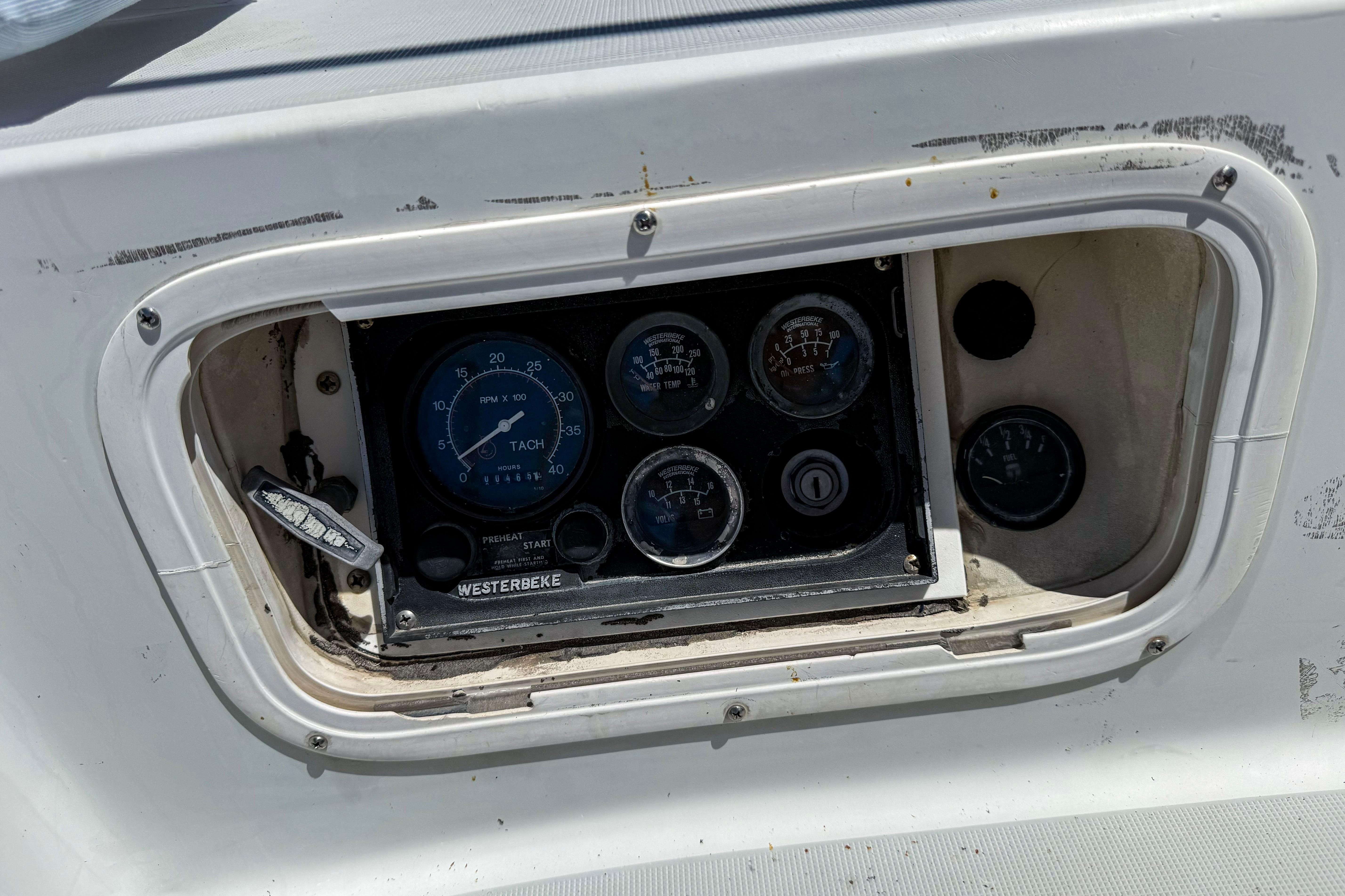 Control panel of a 1988 Oday 40 sailboat with gauges and switches.