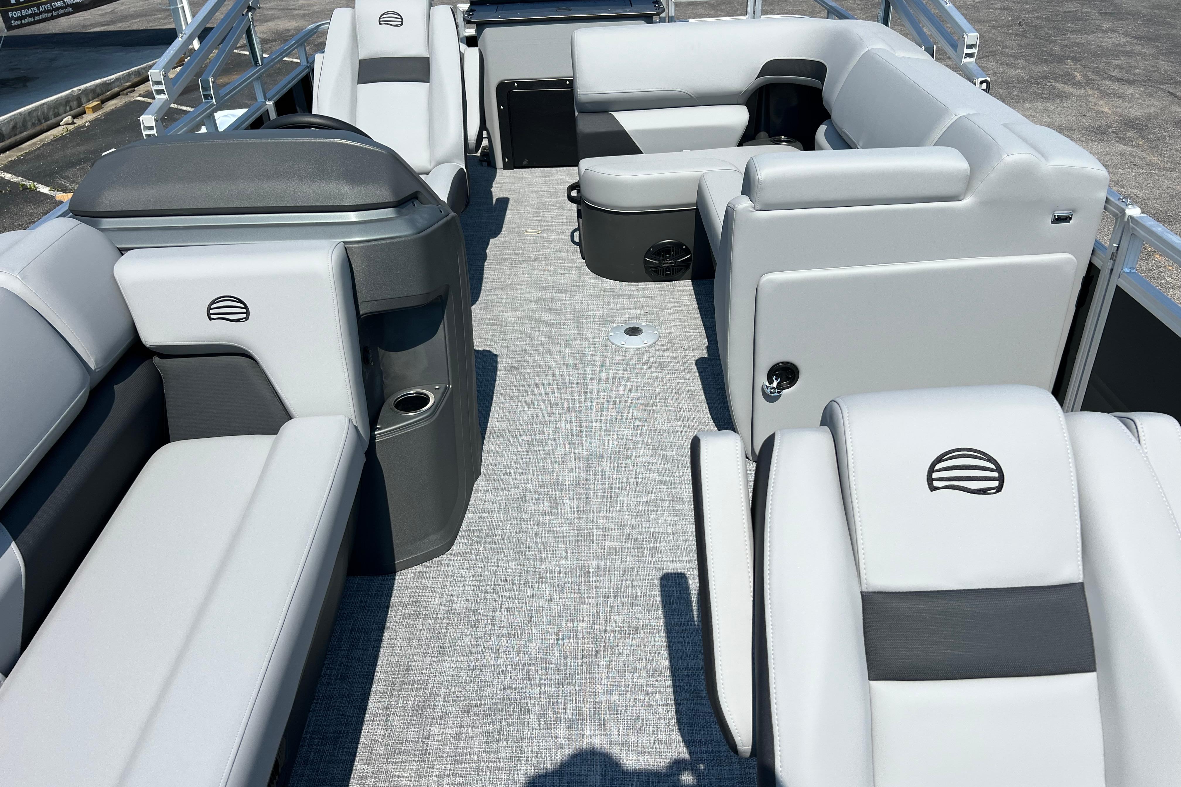 2026 Sun Tracker SportFish 20 DLX pontoon boat interior with gray seating and modern design.