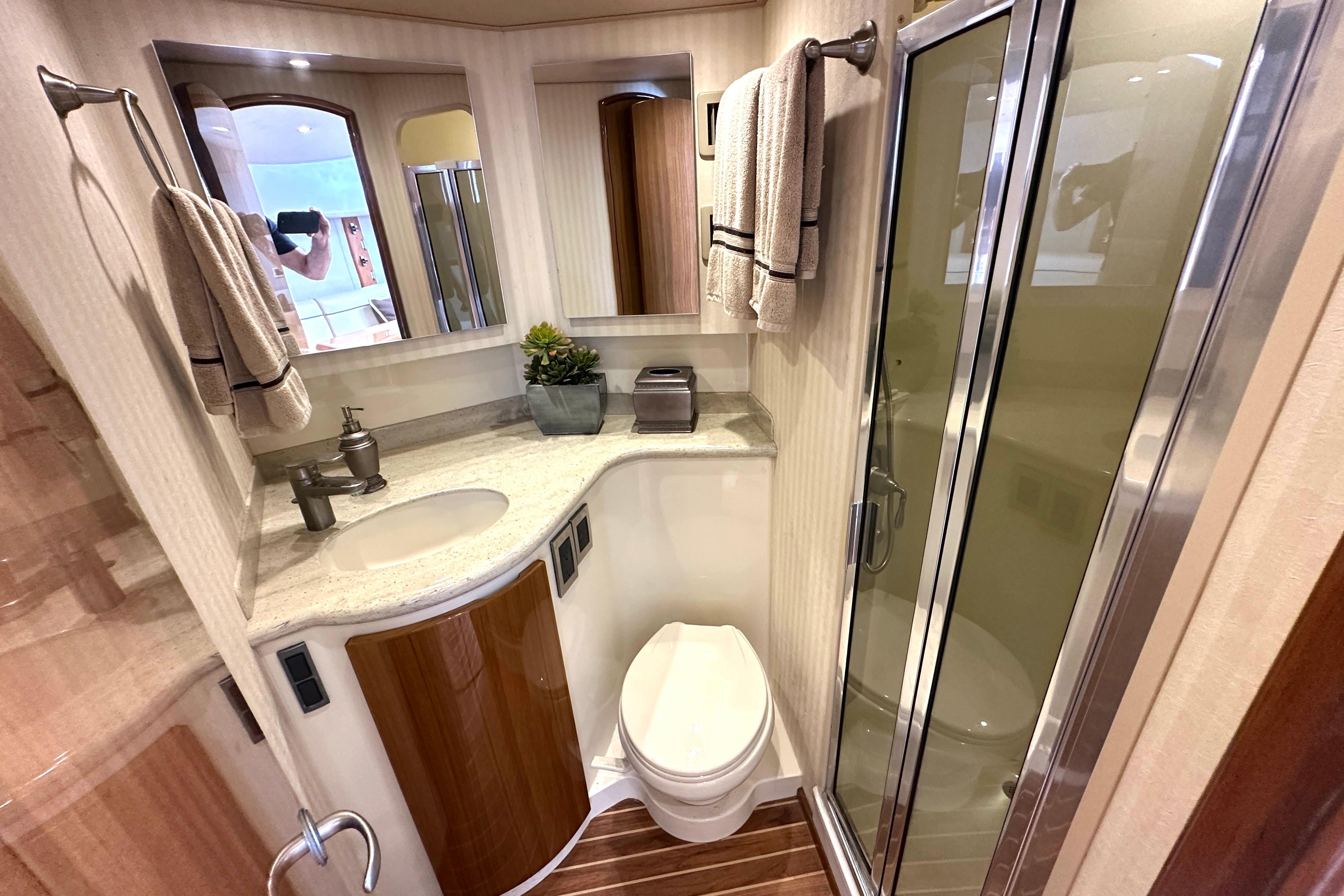 Luxurious bathroom in 2012 Viking 42 Open yacht with modern fixtures and elegant design.