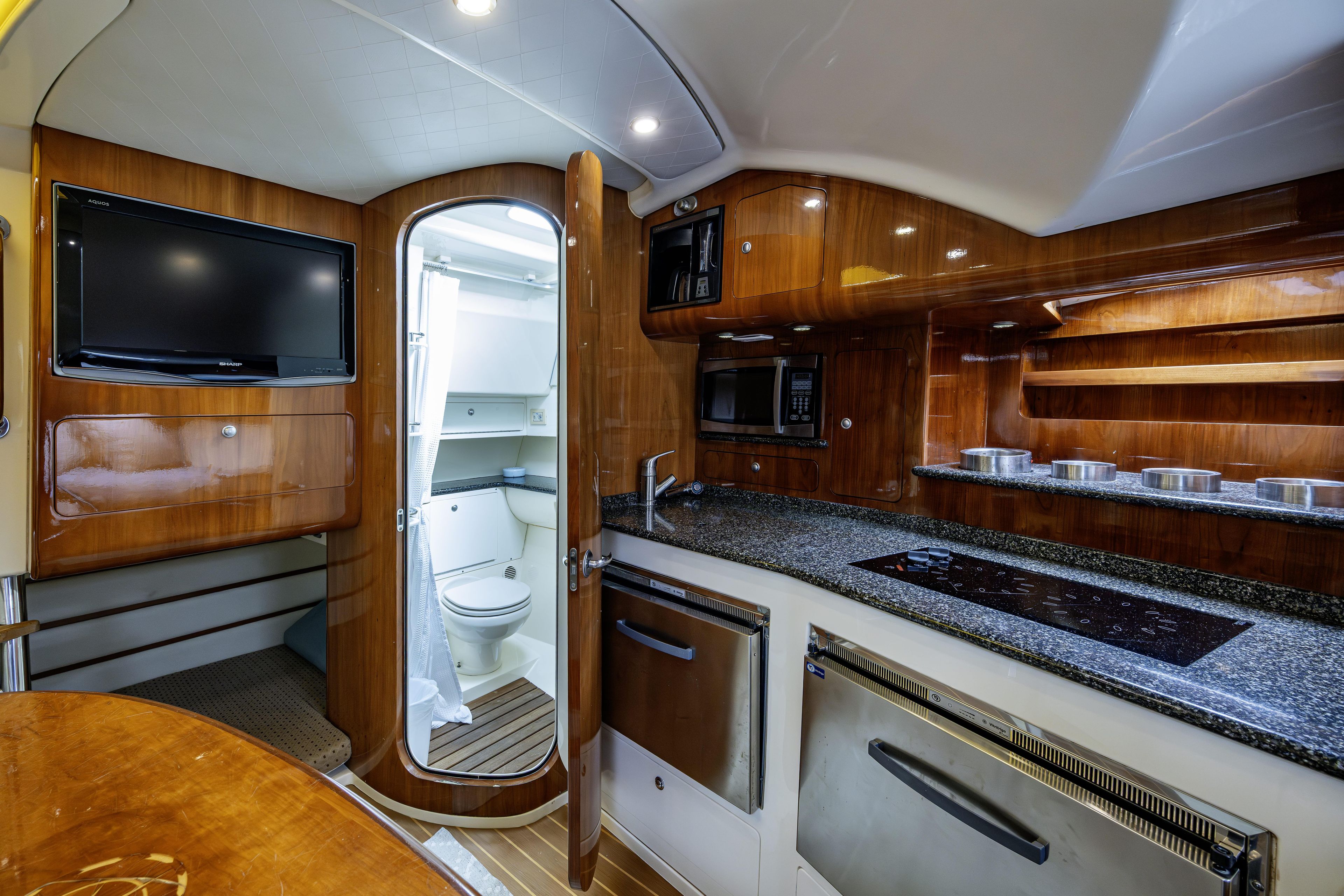 Luxurious 2010 Scout 350 Abaco yacht interior with modern kitchen and bathroom amenities.