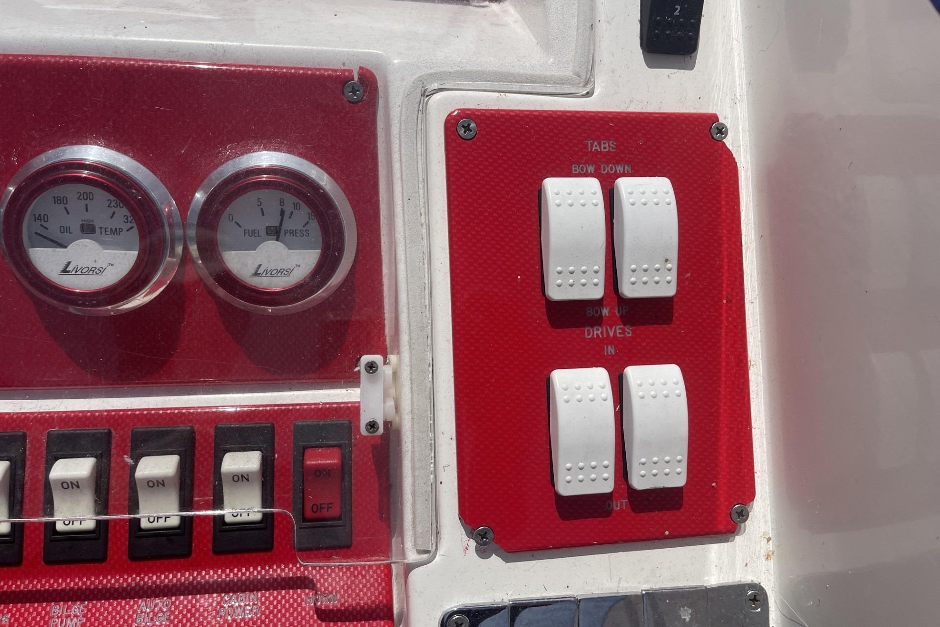 Control panel of a 2006 Sonic 386 boat with gauges and switches.