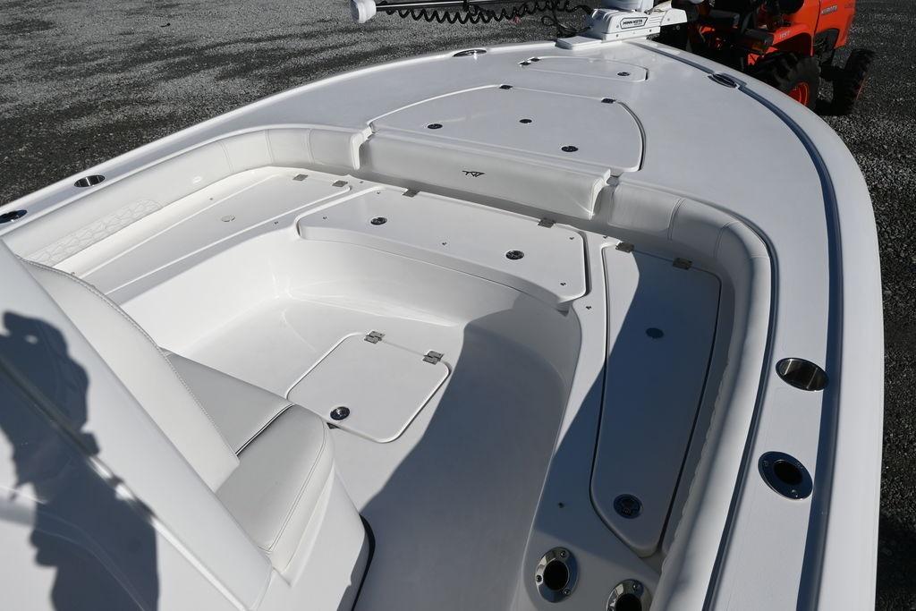 2026 Tidewater 2500 Carolina Bay boat deck with seating and storage compartments.