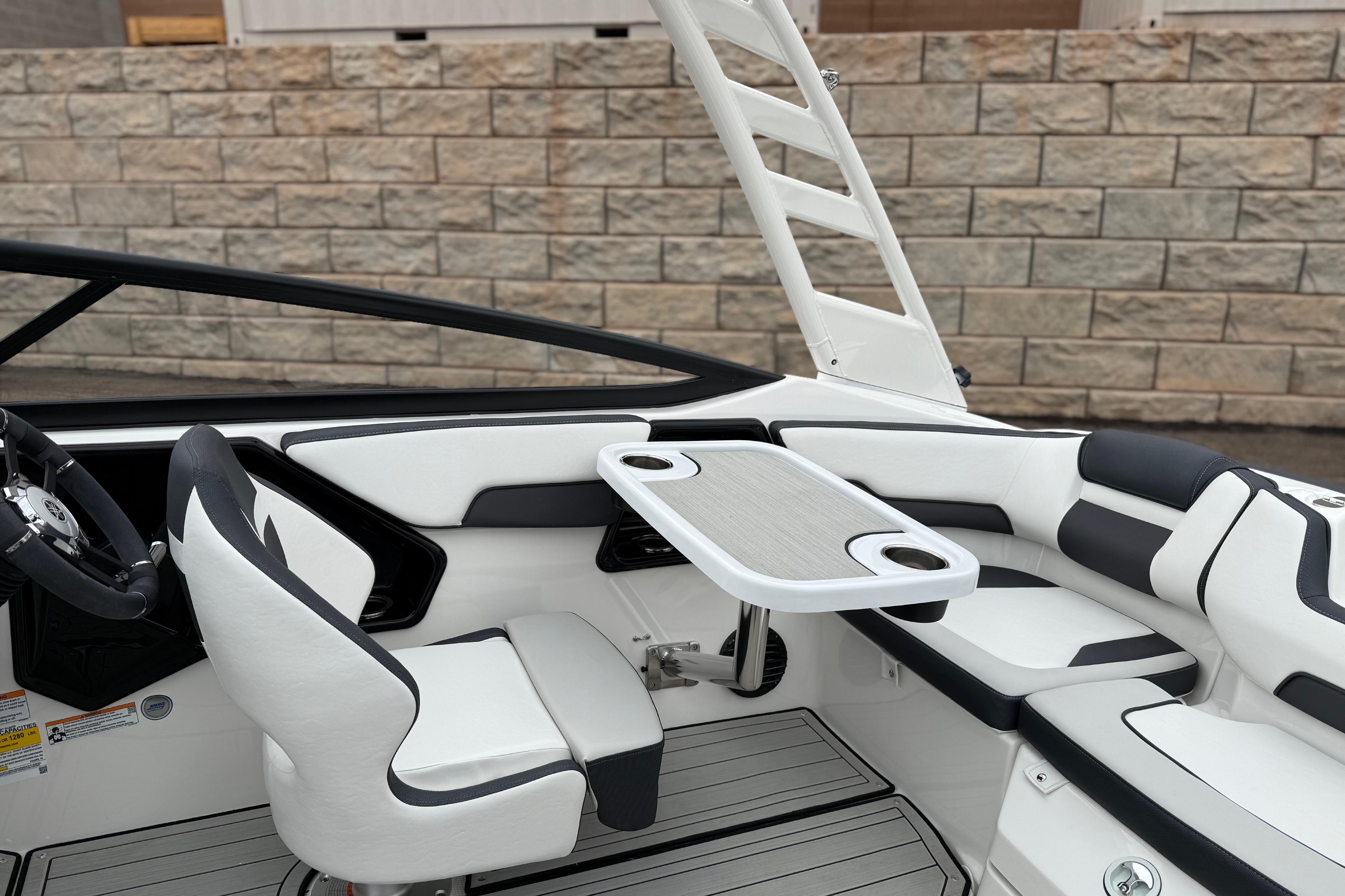 2025 Yamaha Boats 195S interior with sleek seating and modern table design.
