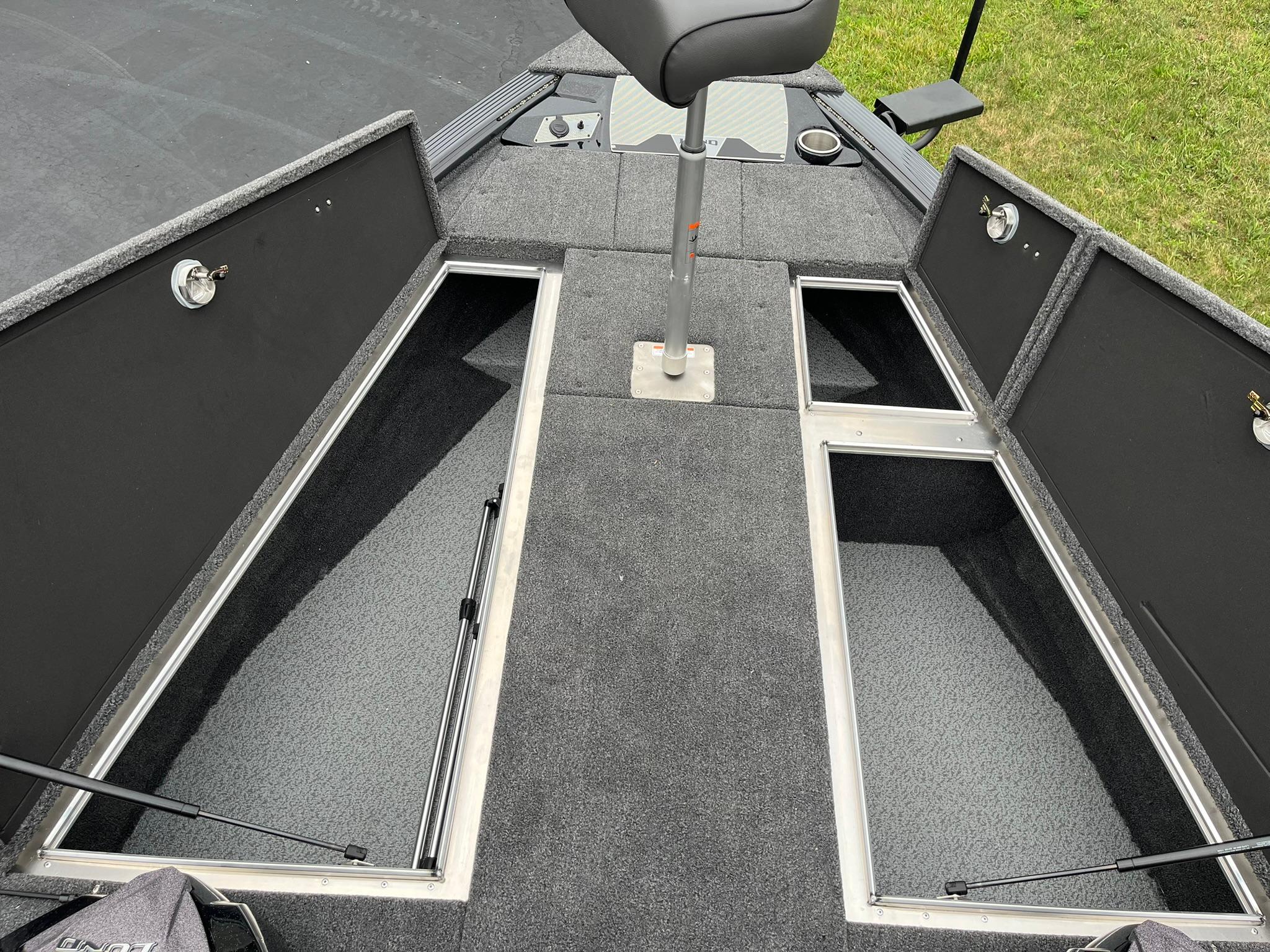 2026 Lund 1875 Pro-V Bass XS boat interior with open storage compartments and seating.