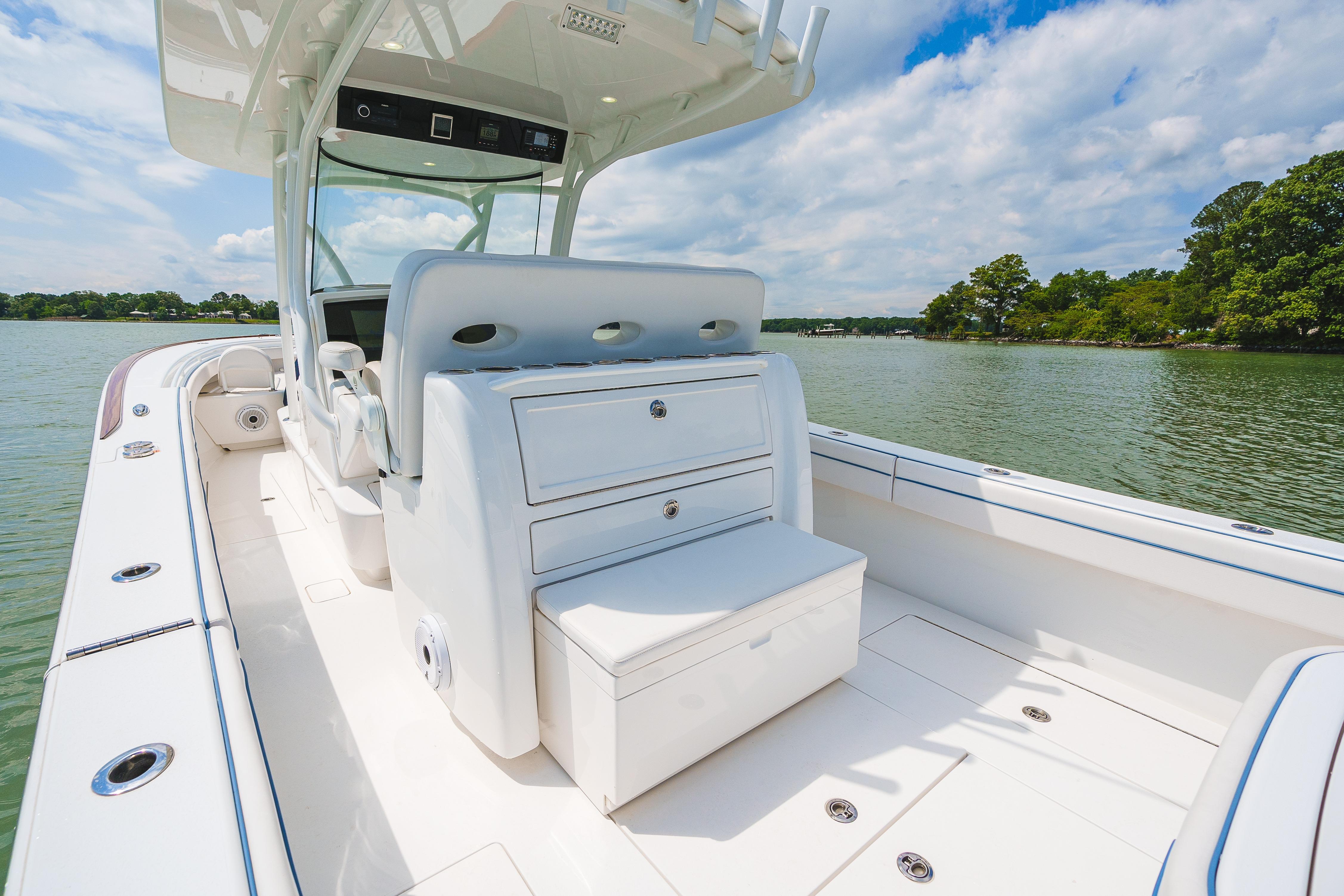 2022 Valhalla Boatworks V-33 on calm water, showcasing sleek design and spacious deck.