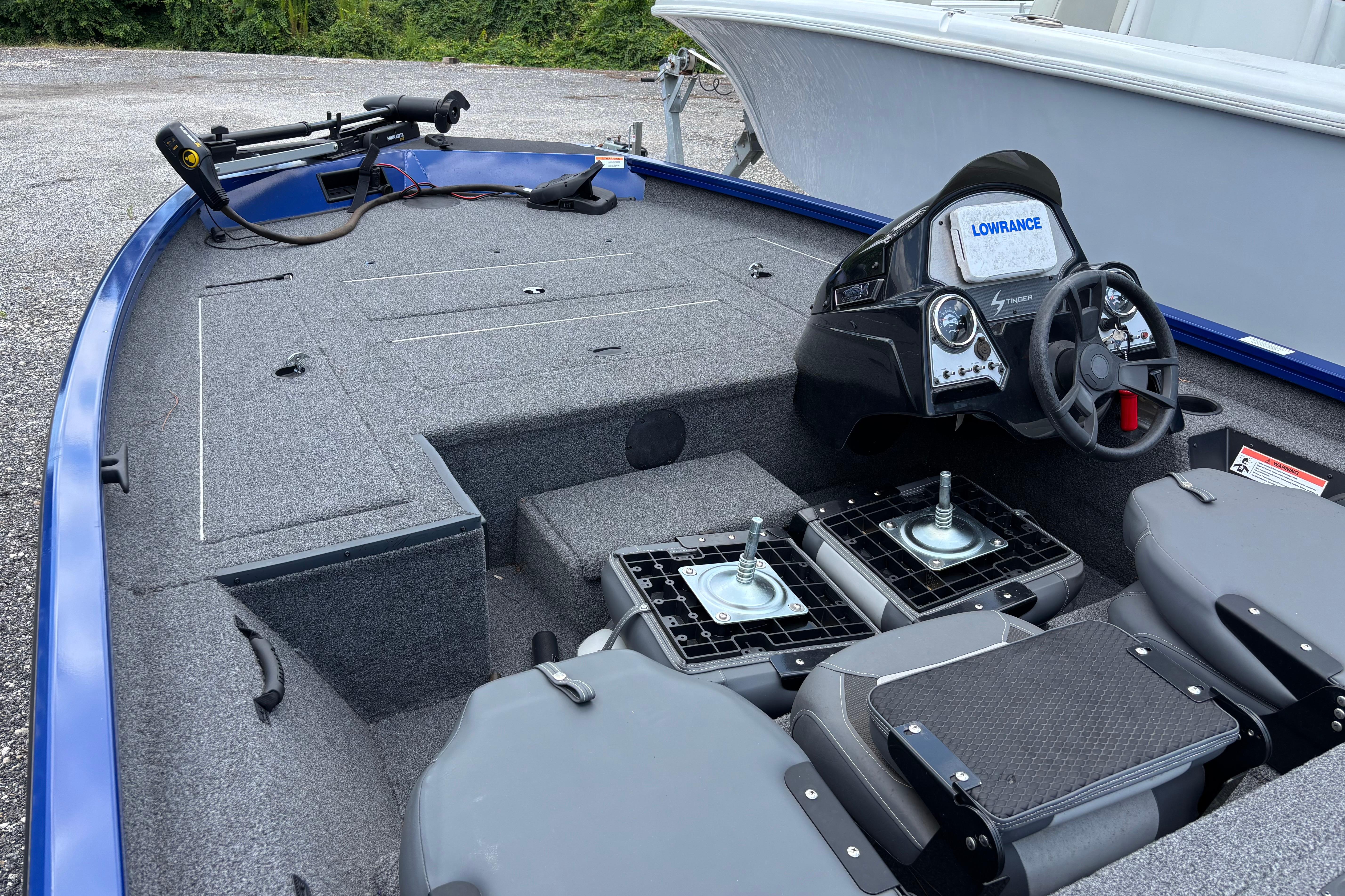 2021 Lowe Stinger 175C boat interior with steering console and seating.