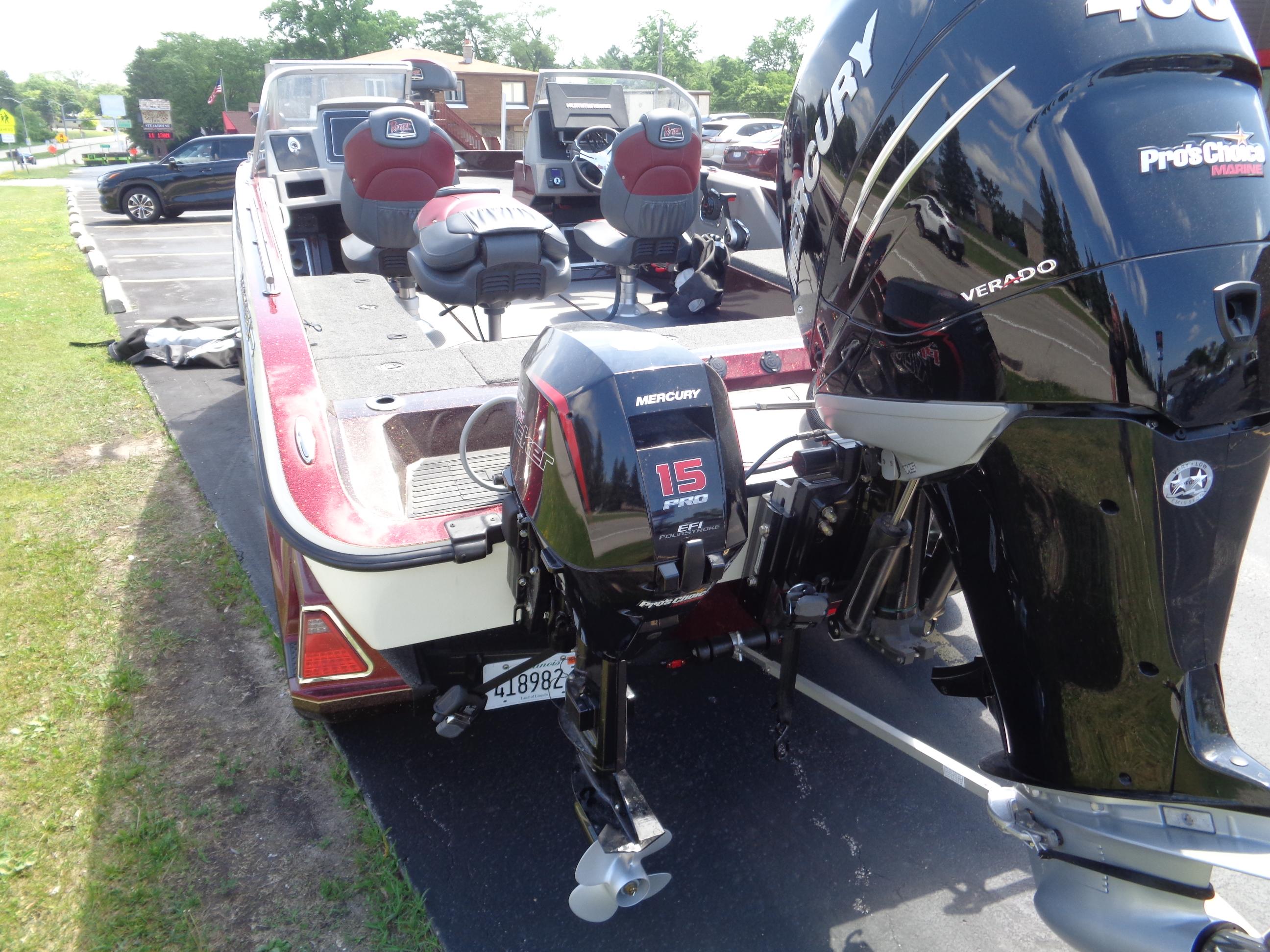 2022 Ranger 621 FS PRO boat with dual Mercury outboard motors, parked on pavement.