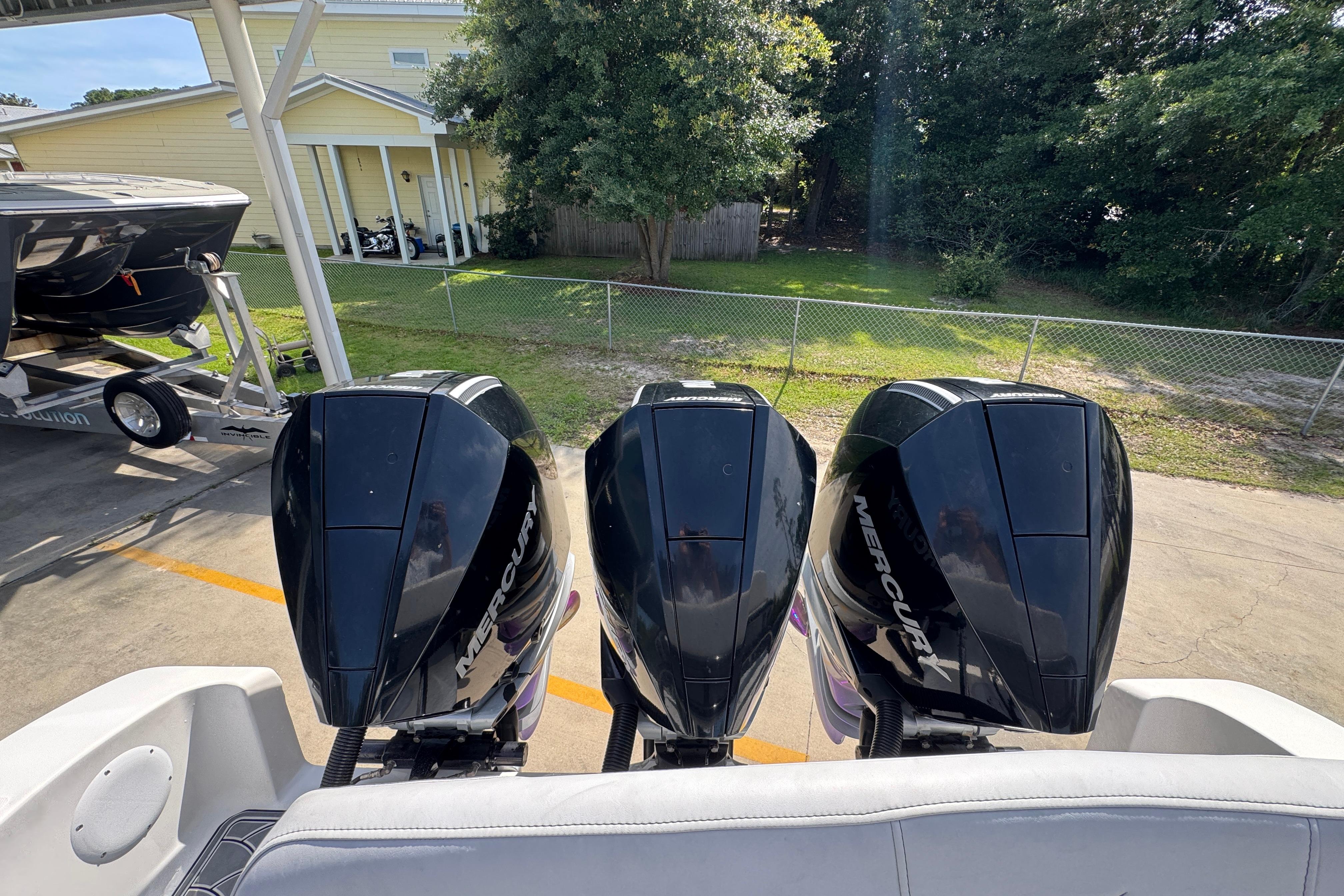 Triple Mercury outboard engines on a 2023 Fountain 34 Tournament Edition boat.