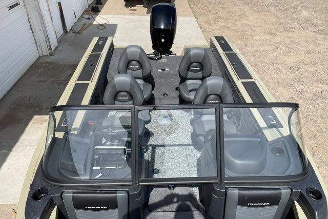 2026 Tracker Targa V-18 WT boat interior with seating and windshield, parked outdoors.