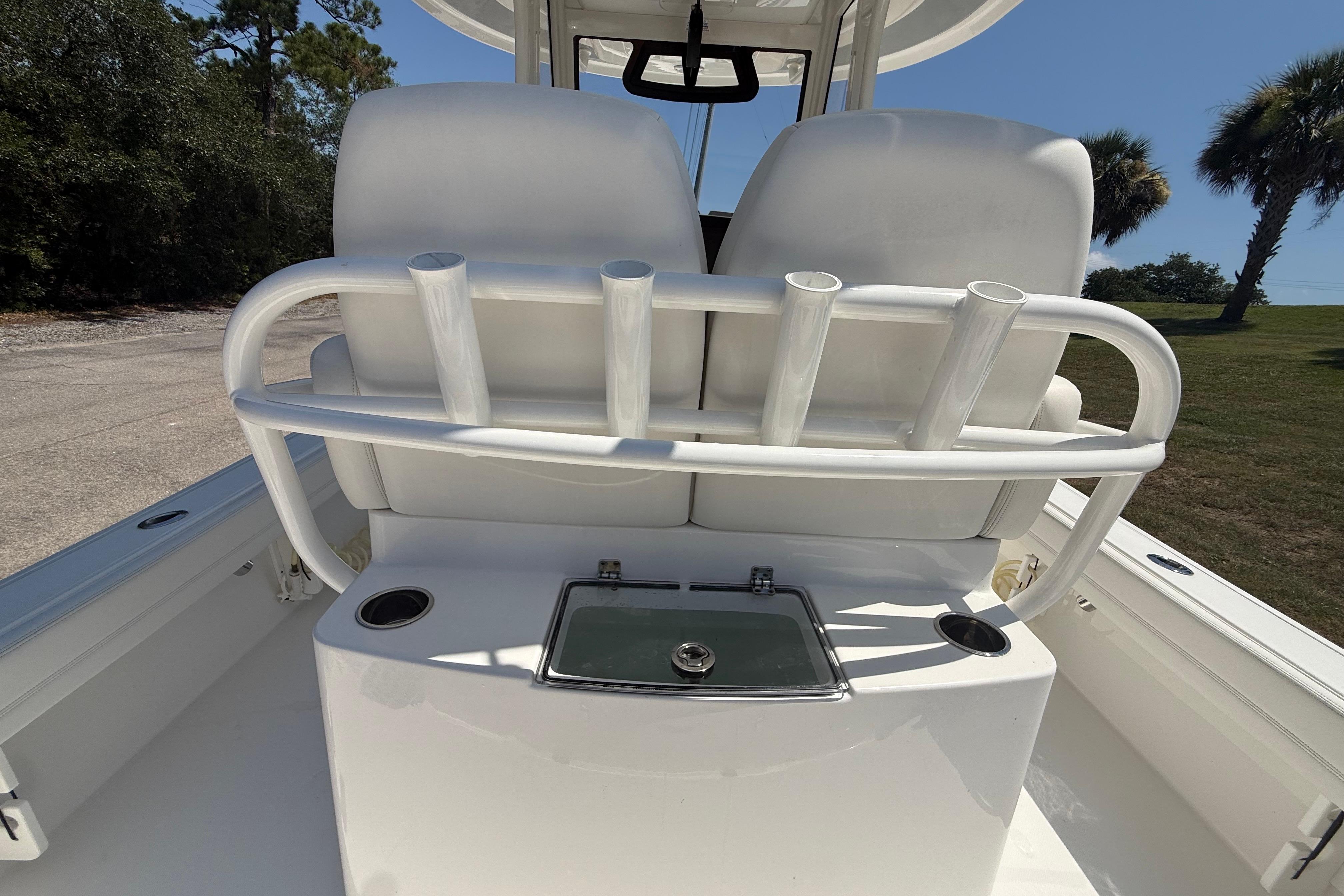 2023 Regulator 26XO boat interior with rod holders and seating.