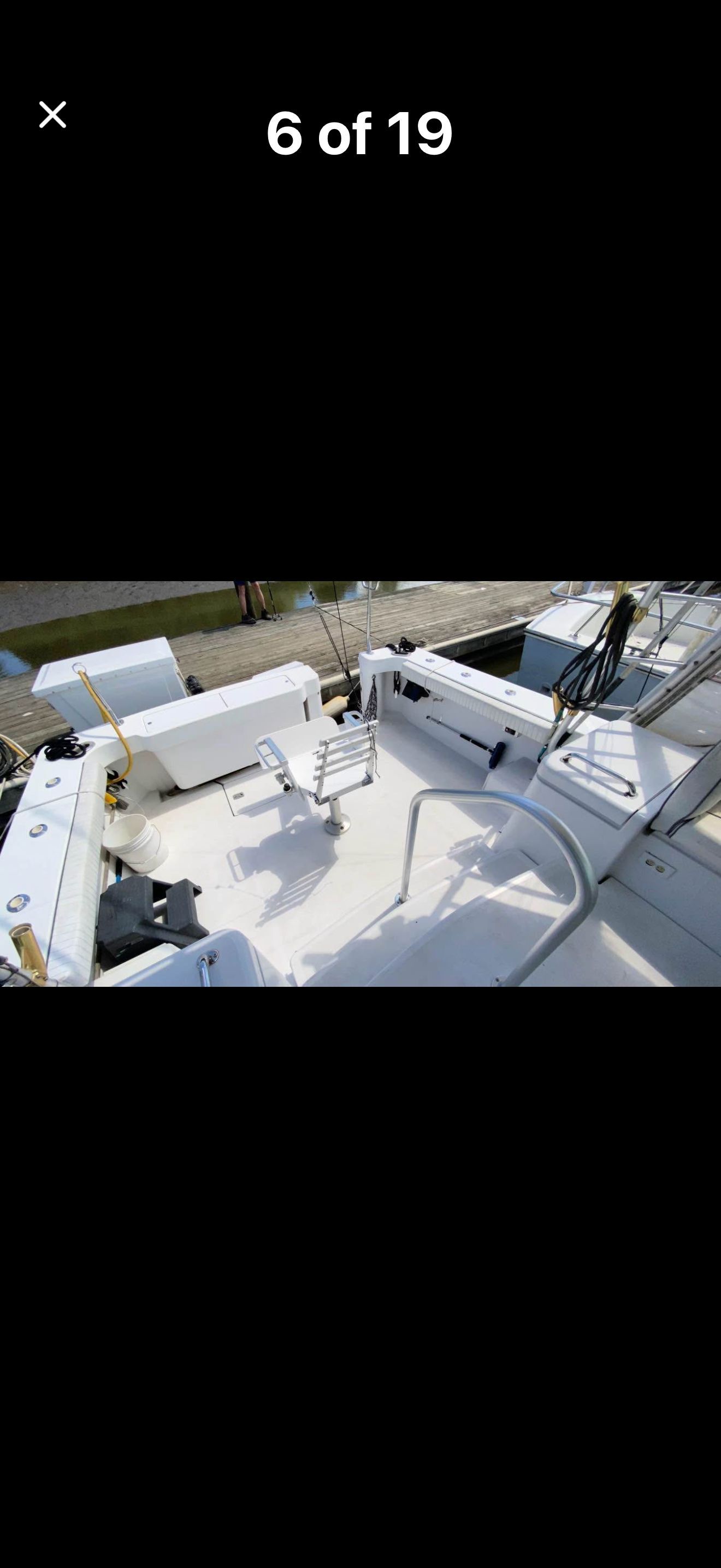 The image shows the spacious aft deck of a 1999 Luhrs Sx36.