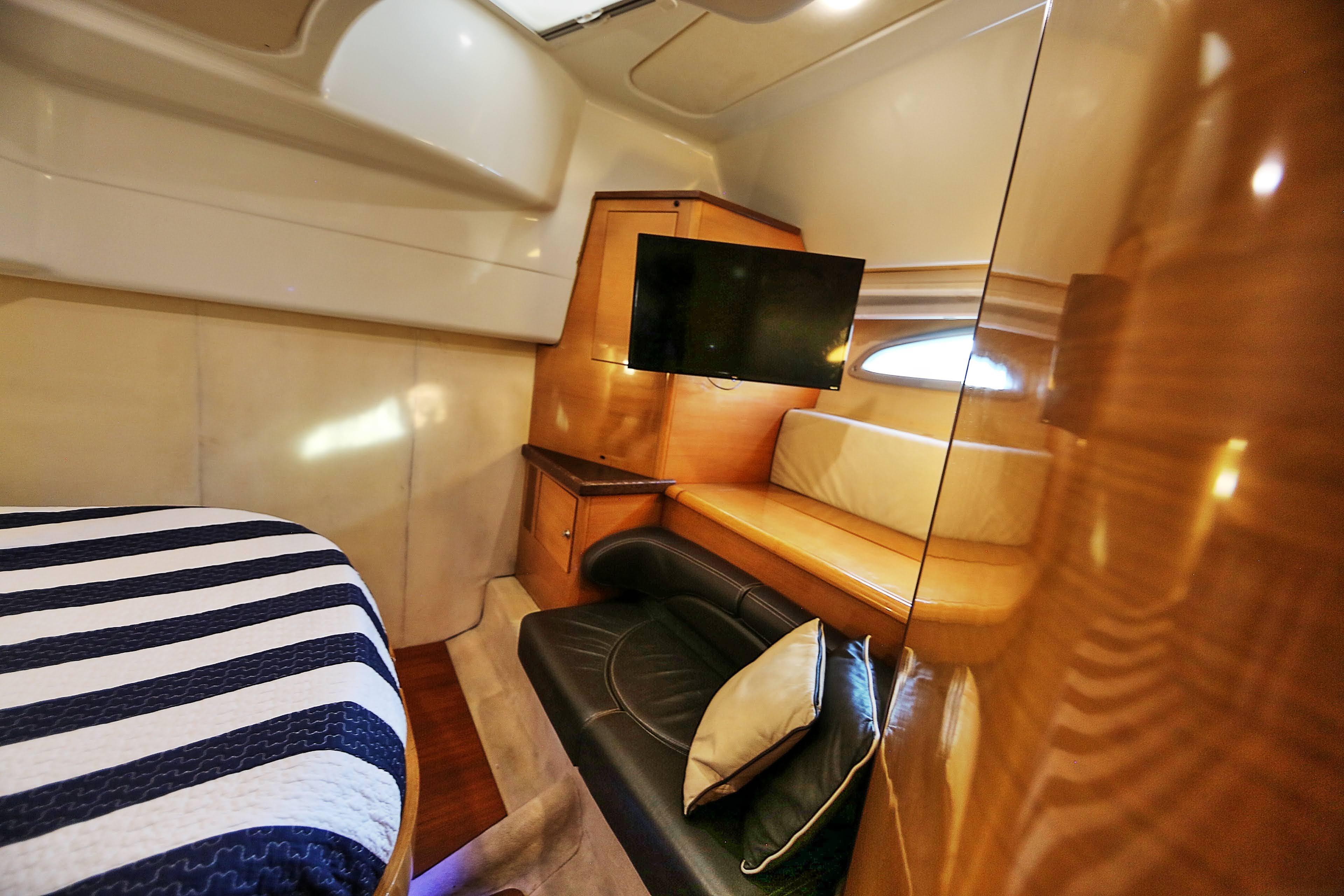 Luxurious interior of 2008 Cranchi Mediterranee 43 yacht with cozy seating and modern amenities.