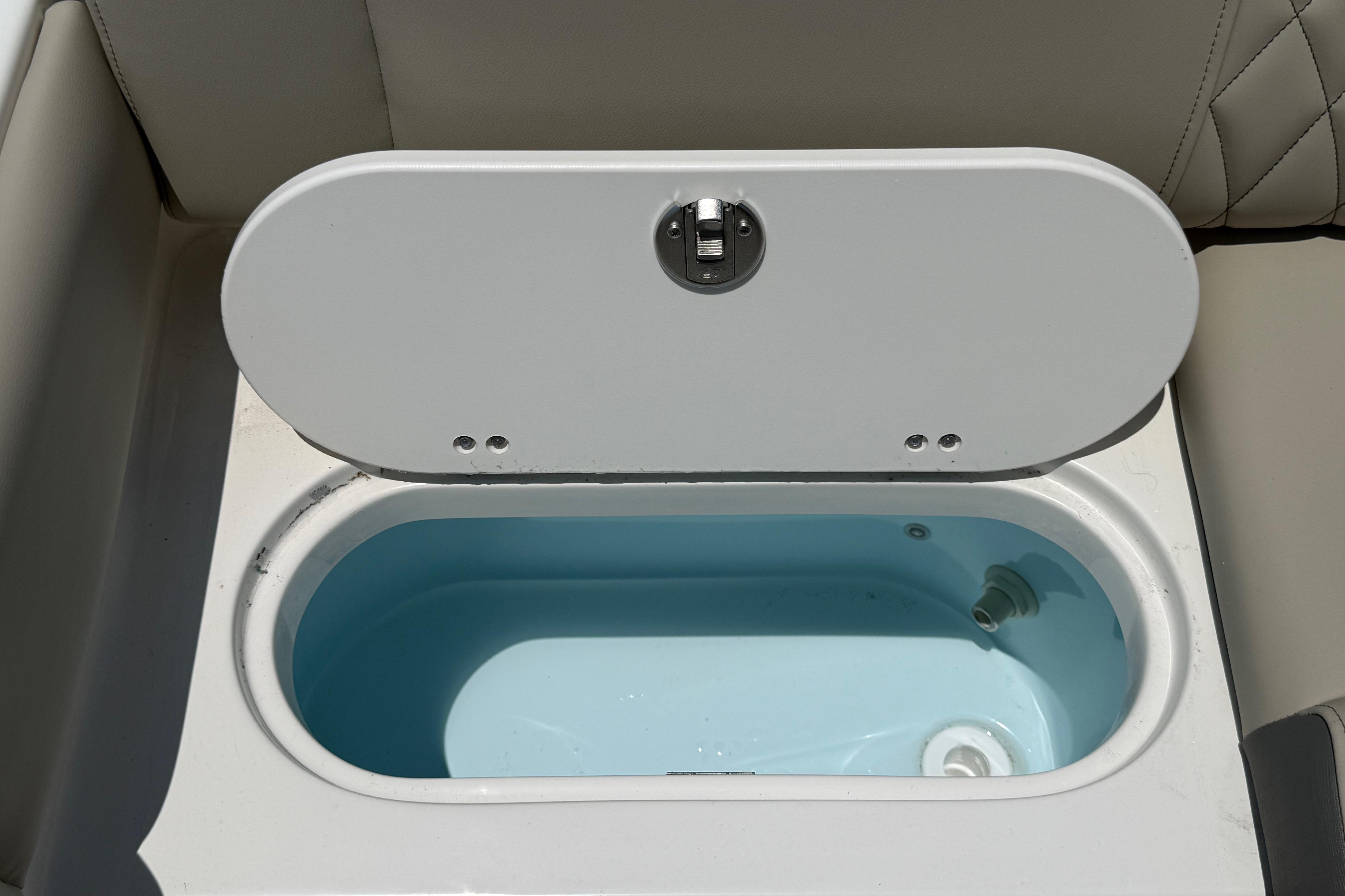 Open storage compartment on 2027 Key West 249 FS boat, featuring a sleek design.
