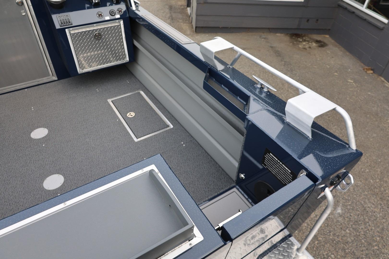 Interior view of 2026 Thunder Jet 24 Alexis Pro boat, featuring sleek design and storage compartments.