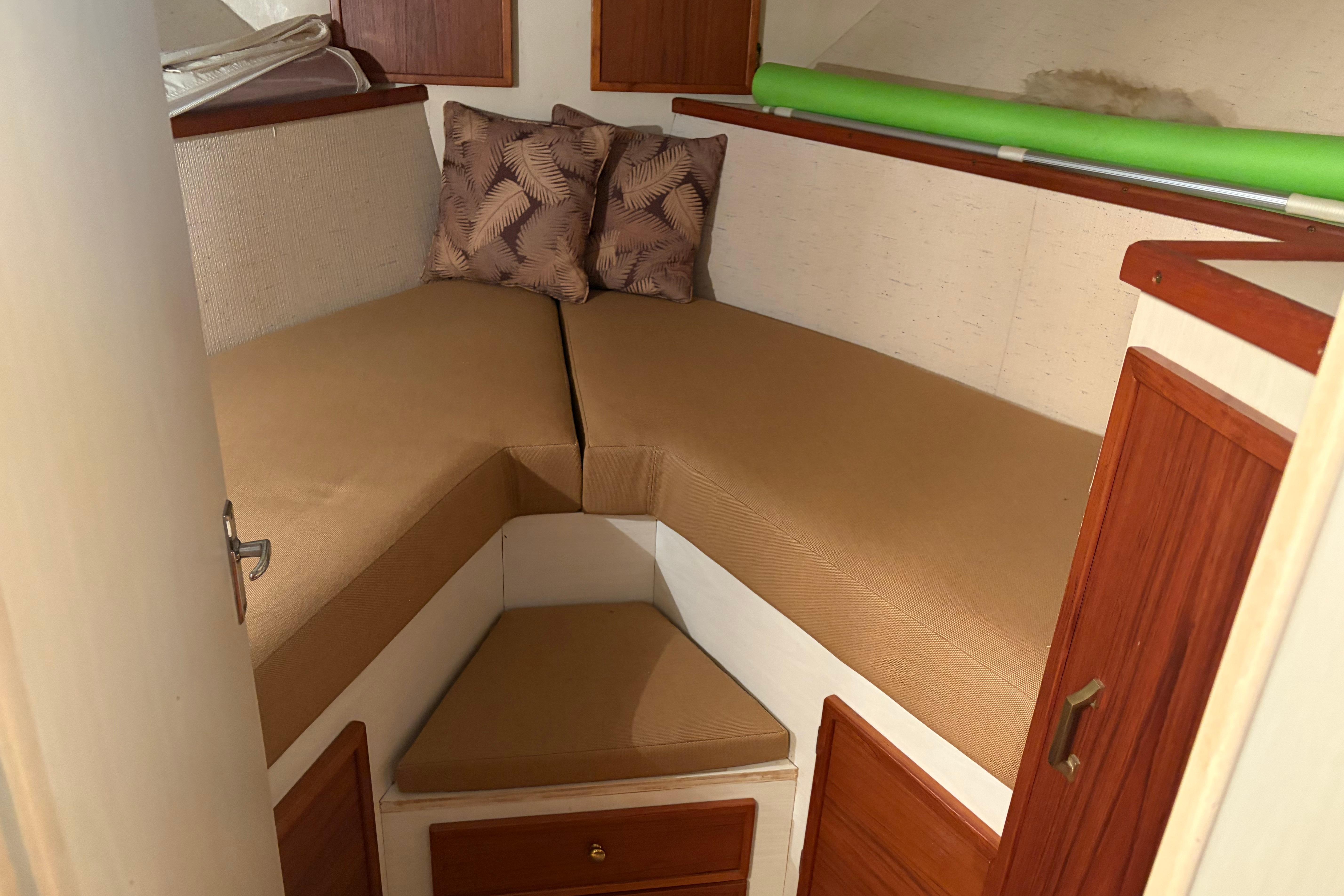 1971 Chris-Craft 42 Commander cabin interior with beige cushions and wooden accents.